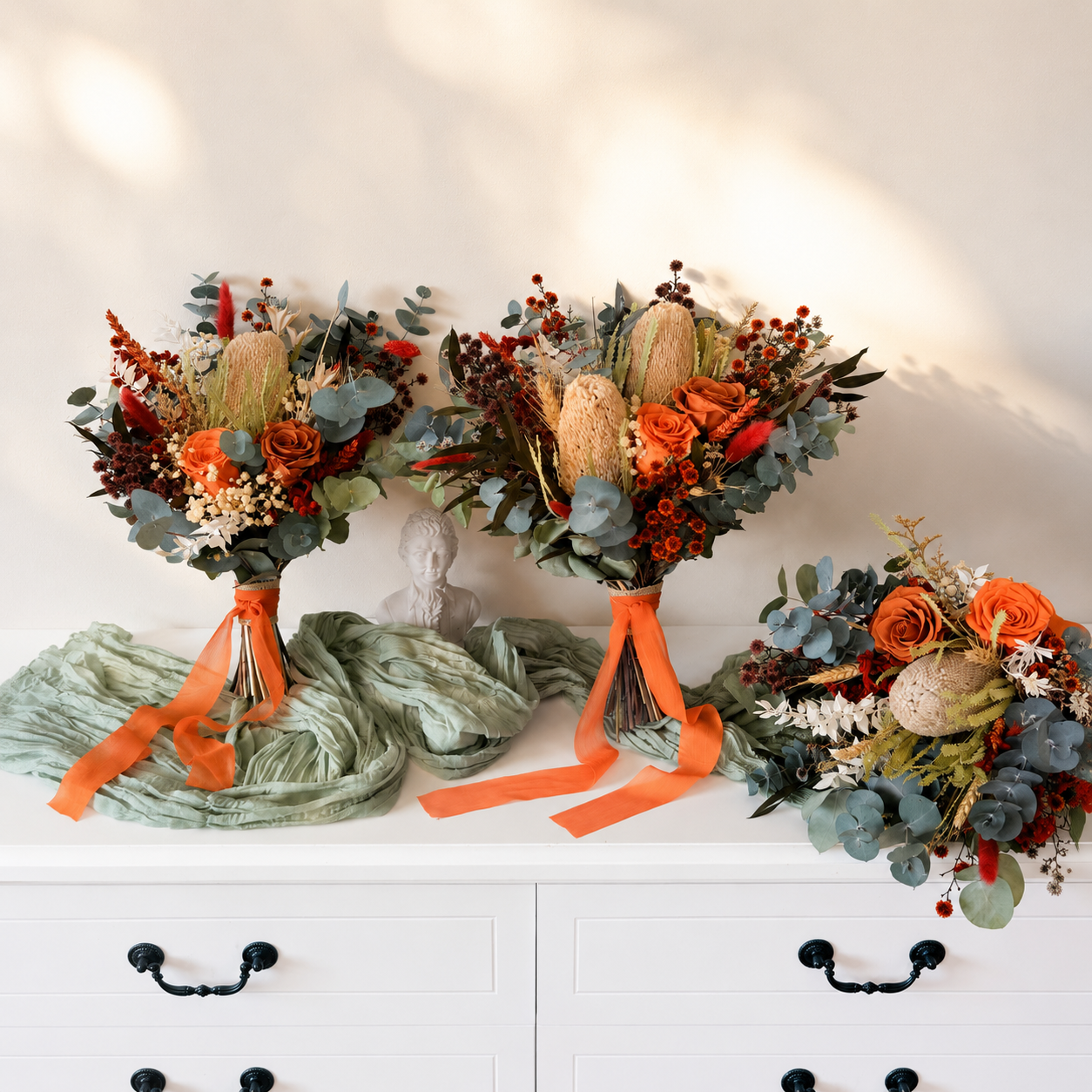 floral bridal bouquet with orange ribbons and flowers
