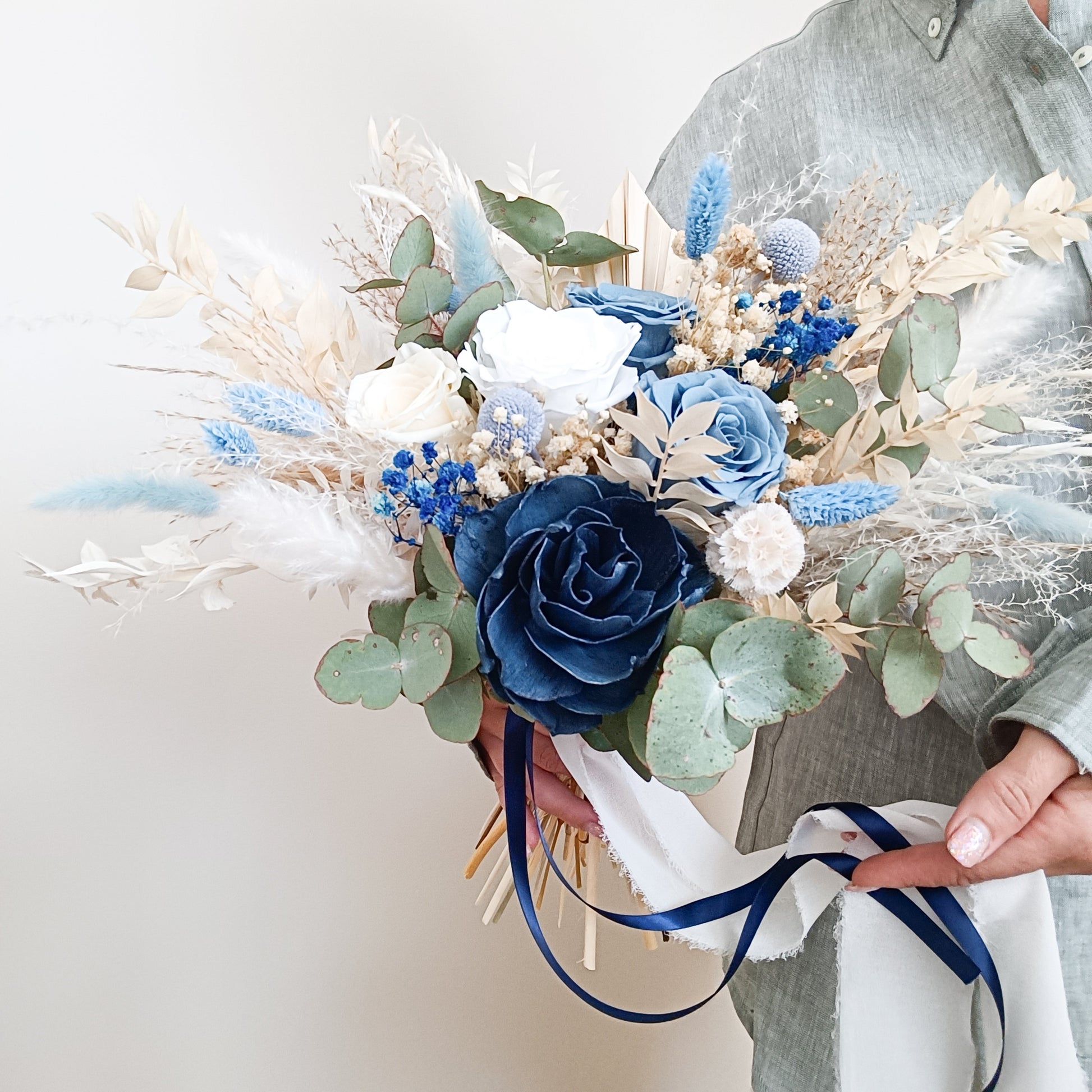 Detailed view of dried bouquet with preserved navy rose, white florals, and mixed textures – perfect for coastal or modern weddings.