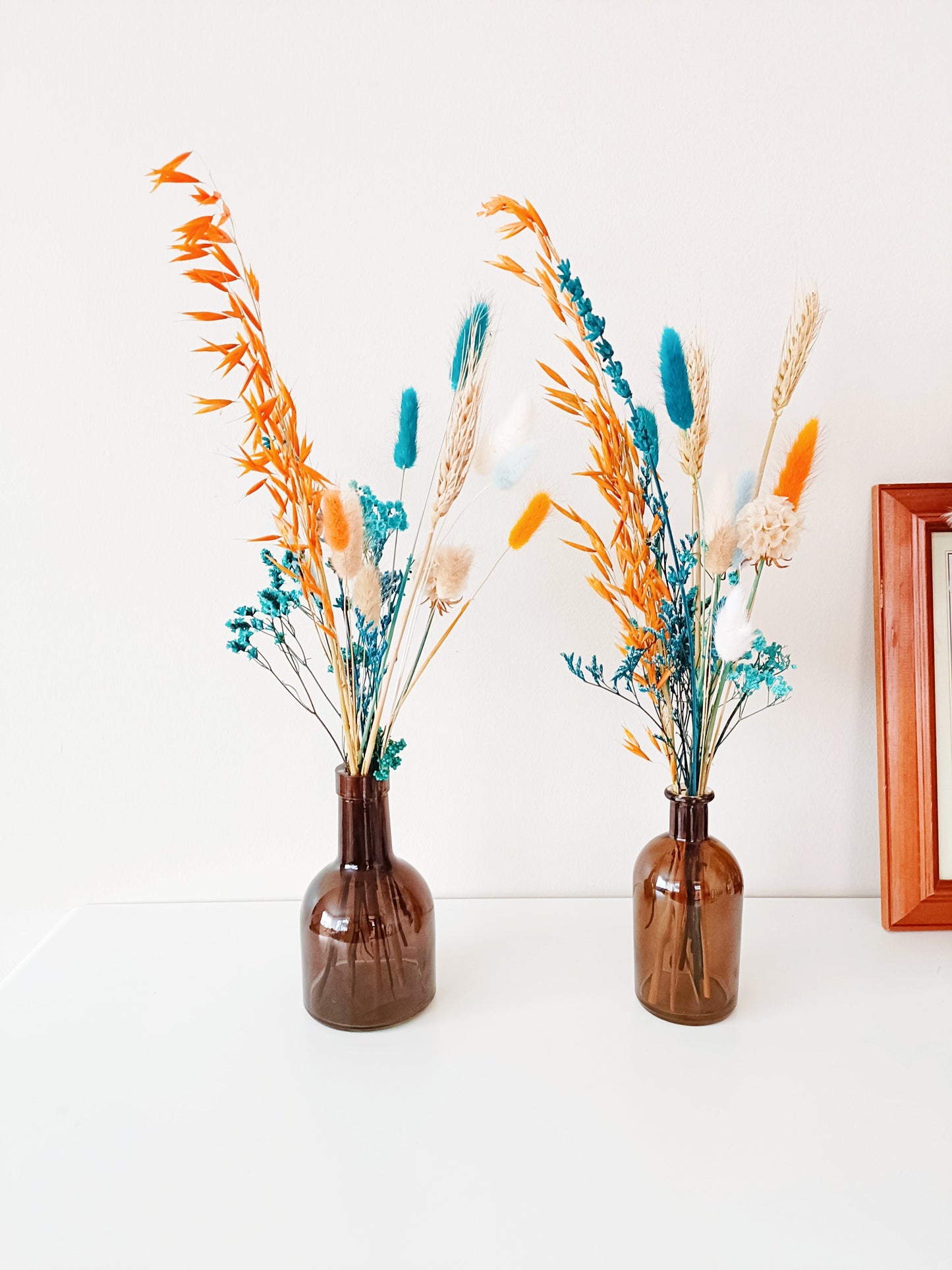 Boho centerpiece, dried flower decor, wedding table flowers, rustic floral arrangement, bohemian flower vase, minimalist floral styling, pampas grass arrangement, dried floral bouquet, neutral home decor, aesthetic flower setup, vintage flower display, farmhouse flower decor, pastel dried flowers, blush wedding centerpiece, romantic floral arrangement, natural dried bouquet, table wedding flowers, soft floral centerpiece, eco-friendly wedding flowers, preserved flower display, rustic wedding decor