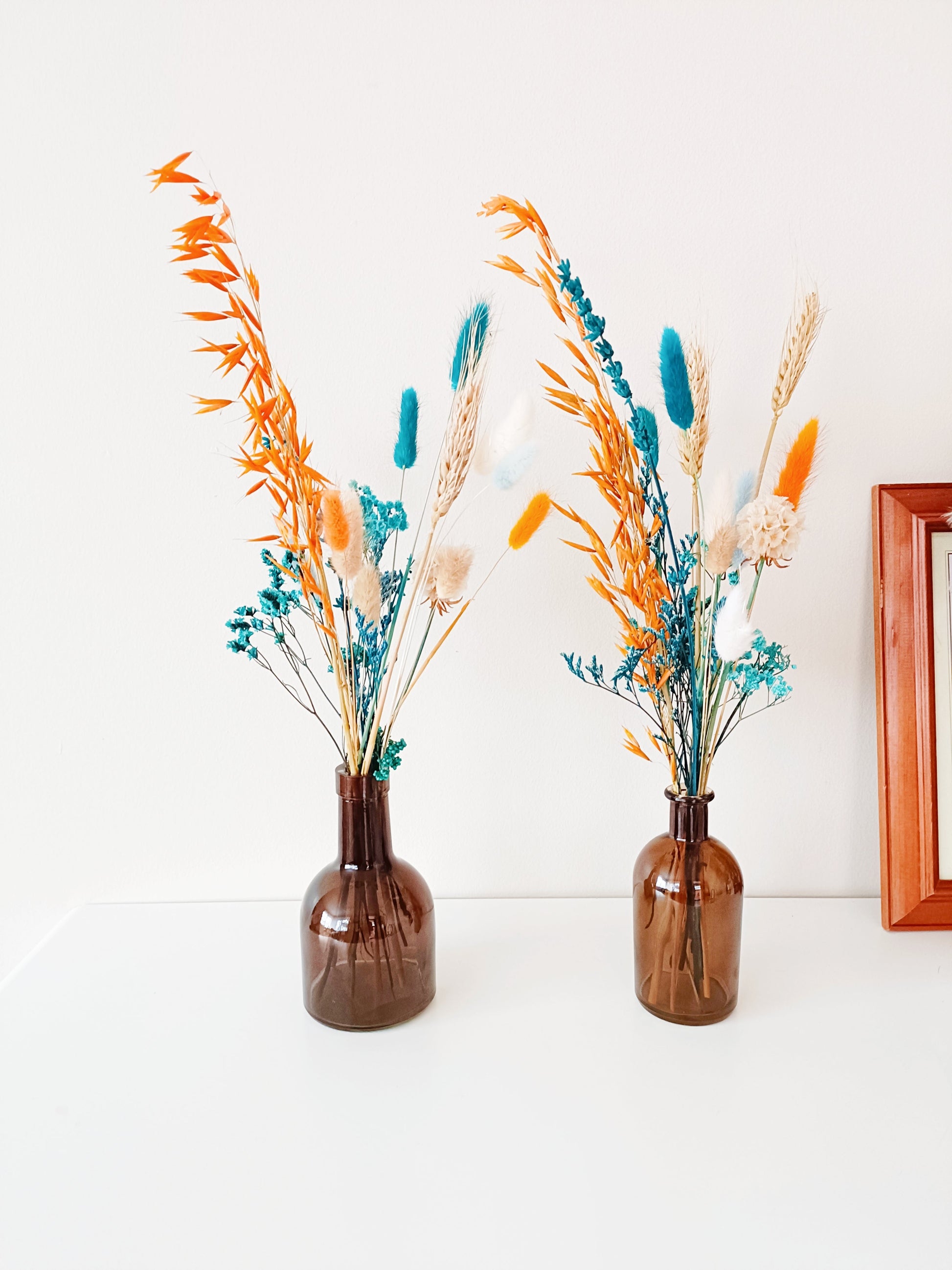 Boho centerpiece, dried flower decor, wedding table flowers, rustic floral arrangement, bohemian flower vase, minimalist floral styling, pampas grass arrangement, dried floral bouquet, neutral home decor, aesthetic flower setup, vintage flower display, farmhouse flower decor, pastel dried flowers, blush wedding centerpiece, romantic floral arrangement, natural dried bouquet, table wedding flowers, soft floral centerpiece, eco-friendly wedding flowers, preserved flower display, rustic wedding decor