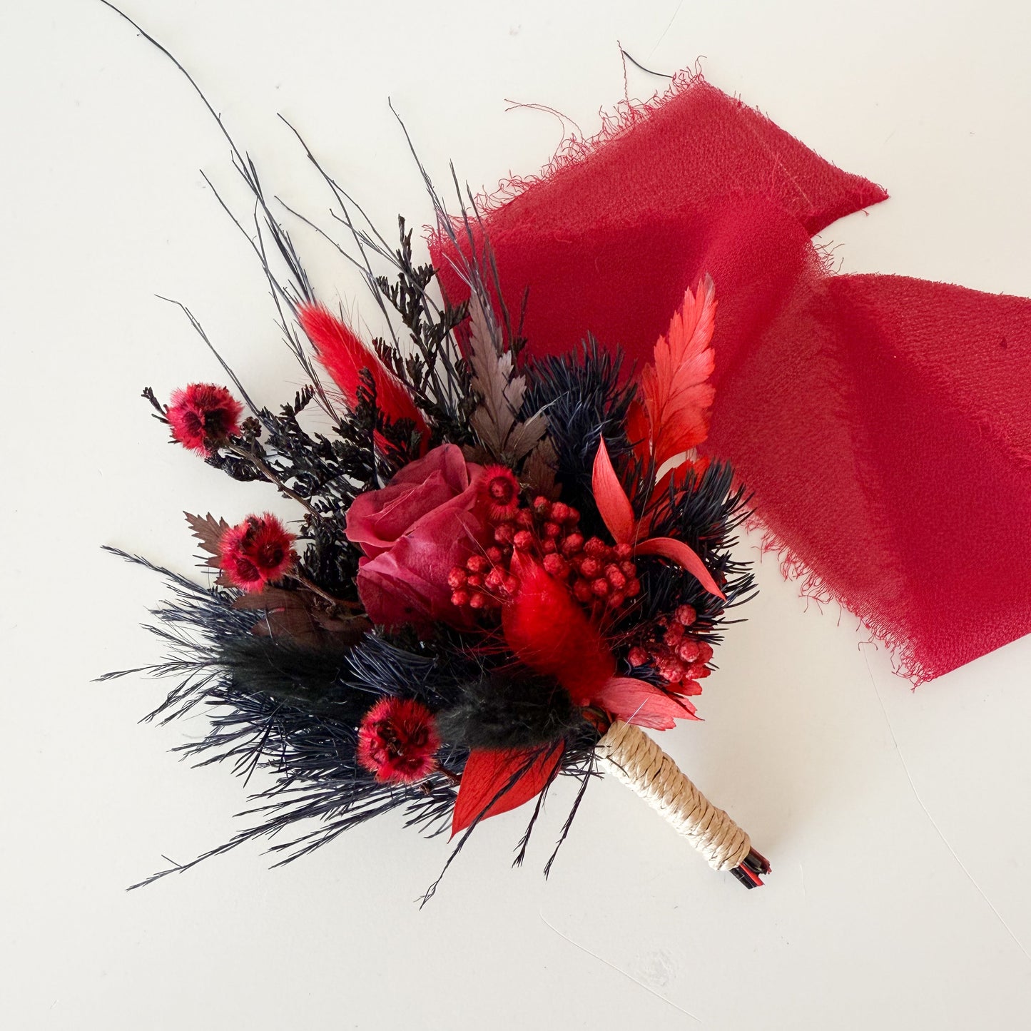 Burgundy and black dried flower boutonniere with preserved rose, gothic groom’s buttonhole for wedding