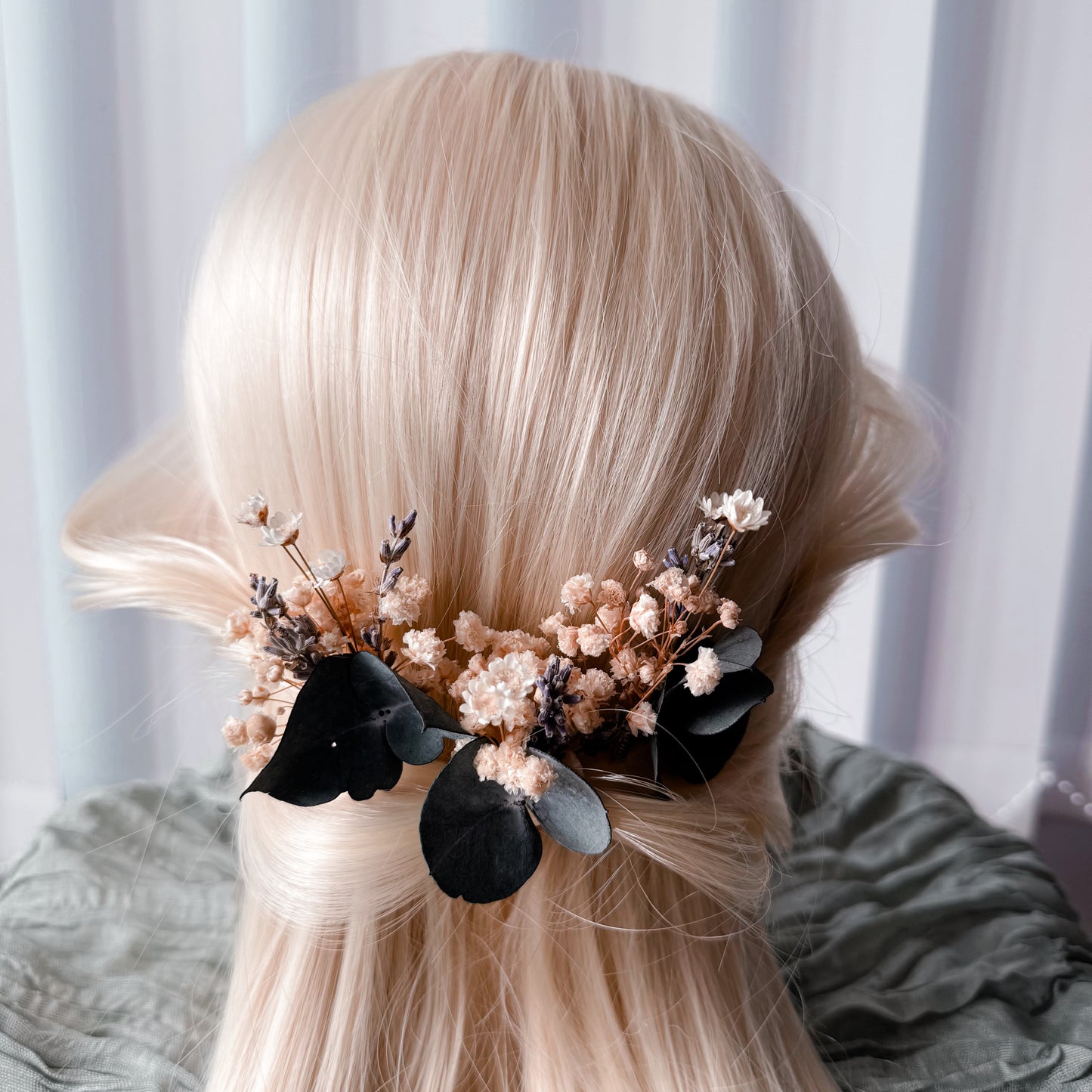 Handmade wedding hair accessories with real eucalyptus leaves and preserved florals, styled on light blonde hair