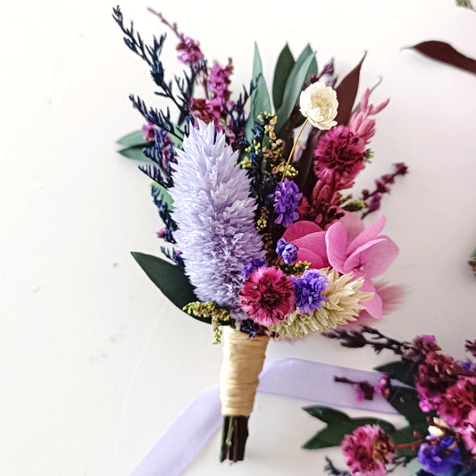 Lavender rose dried boutonniere with purple and plum preserved flowers for boho wedding