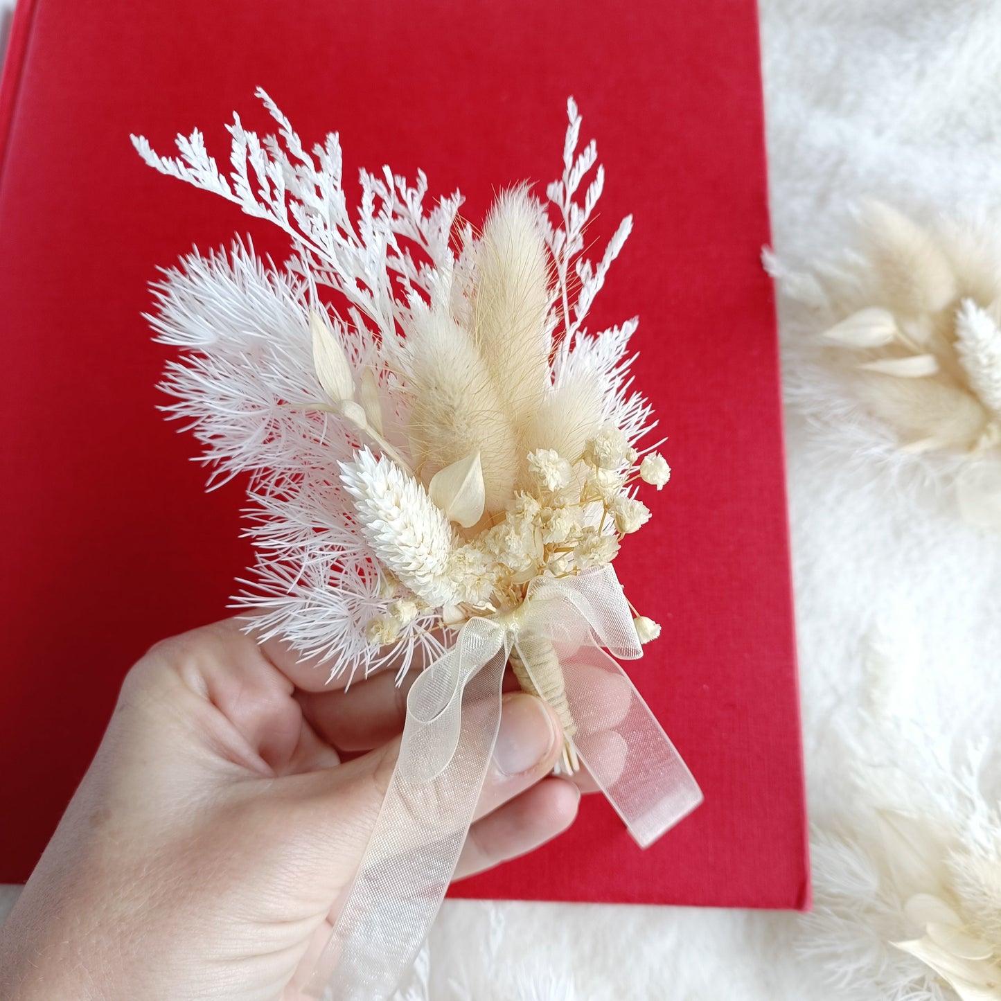 Minimalist groom’s boutonniere made from pampas, bunny tails, and dried florals in beige white