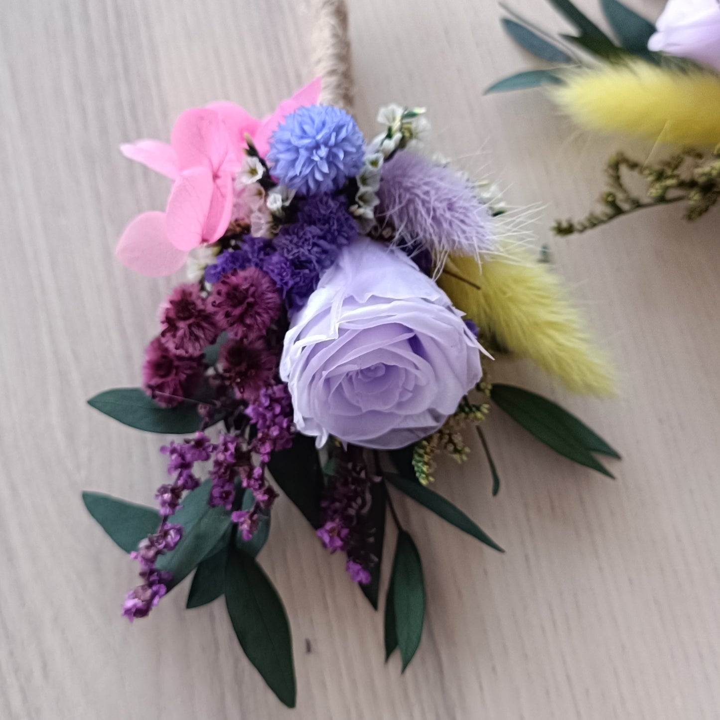 Pastel dried flower buttonhole featuring preserved rose, hydrangea and bunny tails