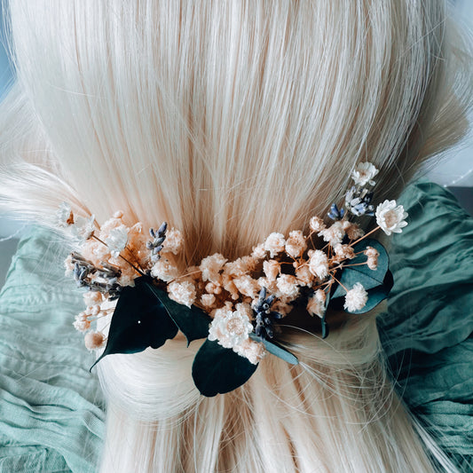 Set of eucalyptus and dried flower wedding hair accessories on a blonde model, perfect for rustic or boho bridal looks