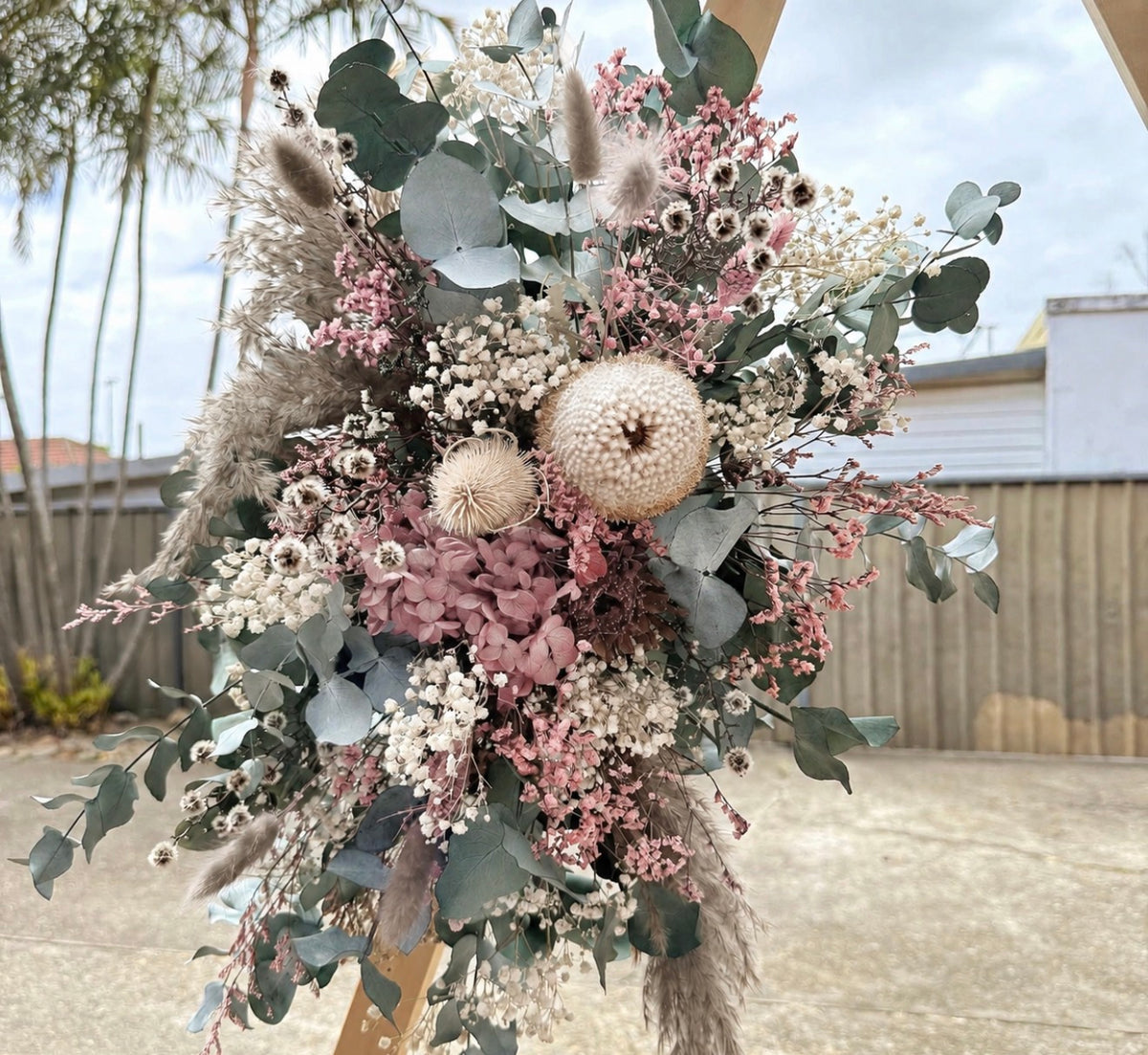 Australian Native Wedding Arch Arrangement featuring banksia, preserved eucalyptus, hydrangea and dried flowers