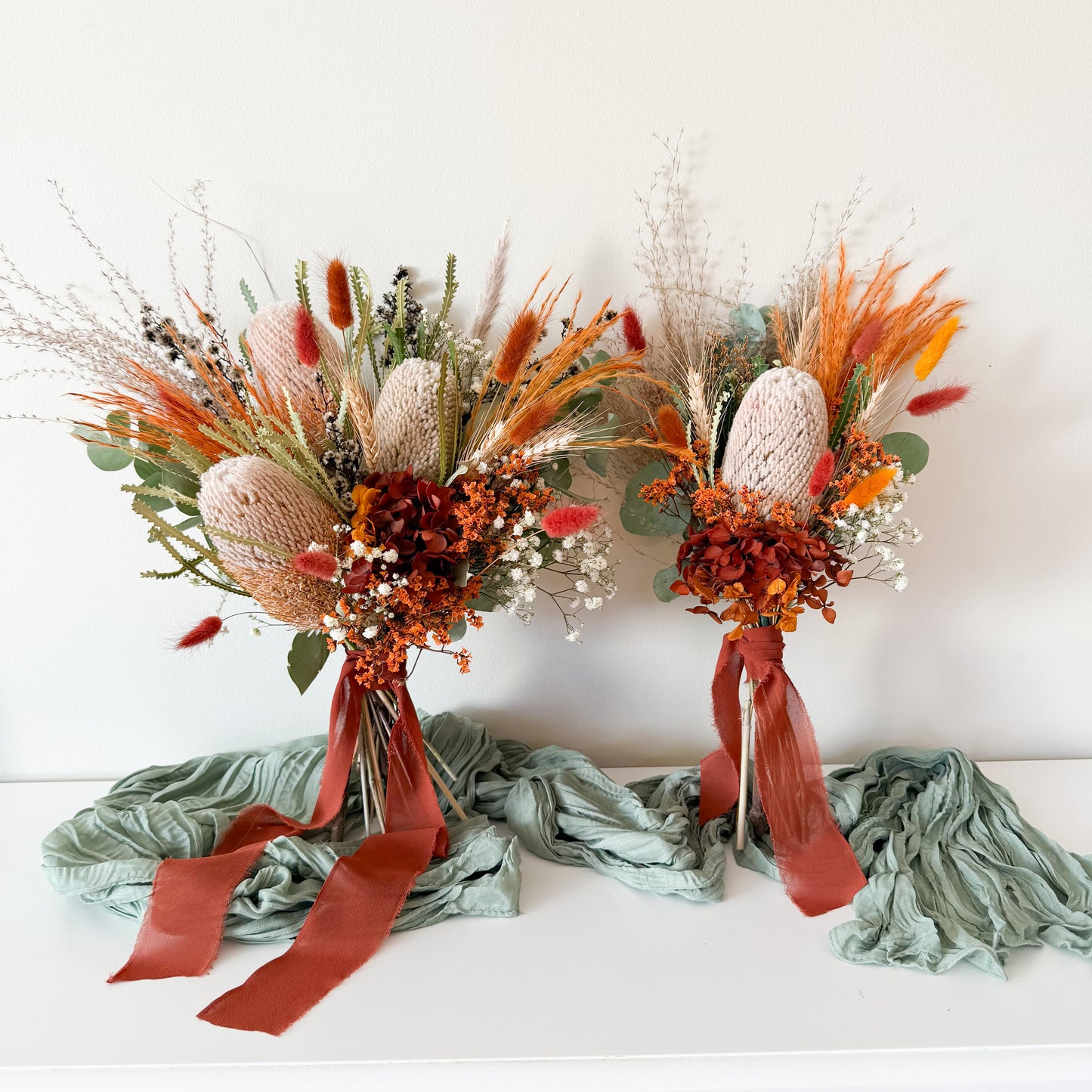 Pair of Australian native dried flower bouquets in earthy tones, perfect for boho weddings or elopements