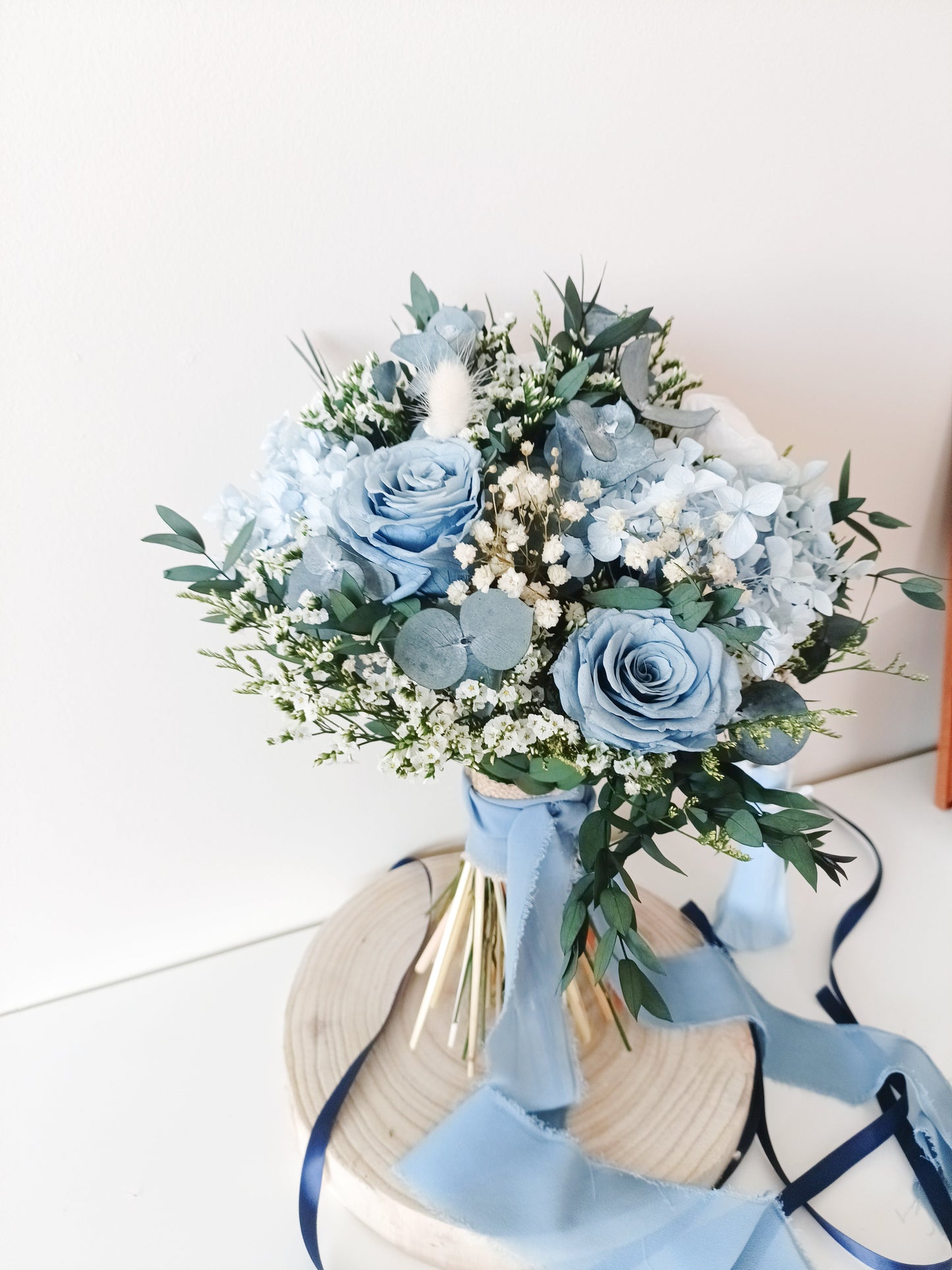Dusty blue bridal bouquet made of dried hydrangea, sola wood rose, and eucalyptus – perfect for elegant, romantic weddings in soft pastel tones.