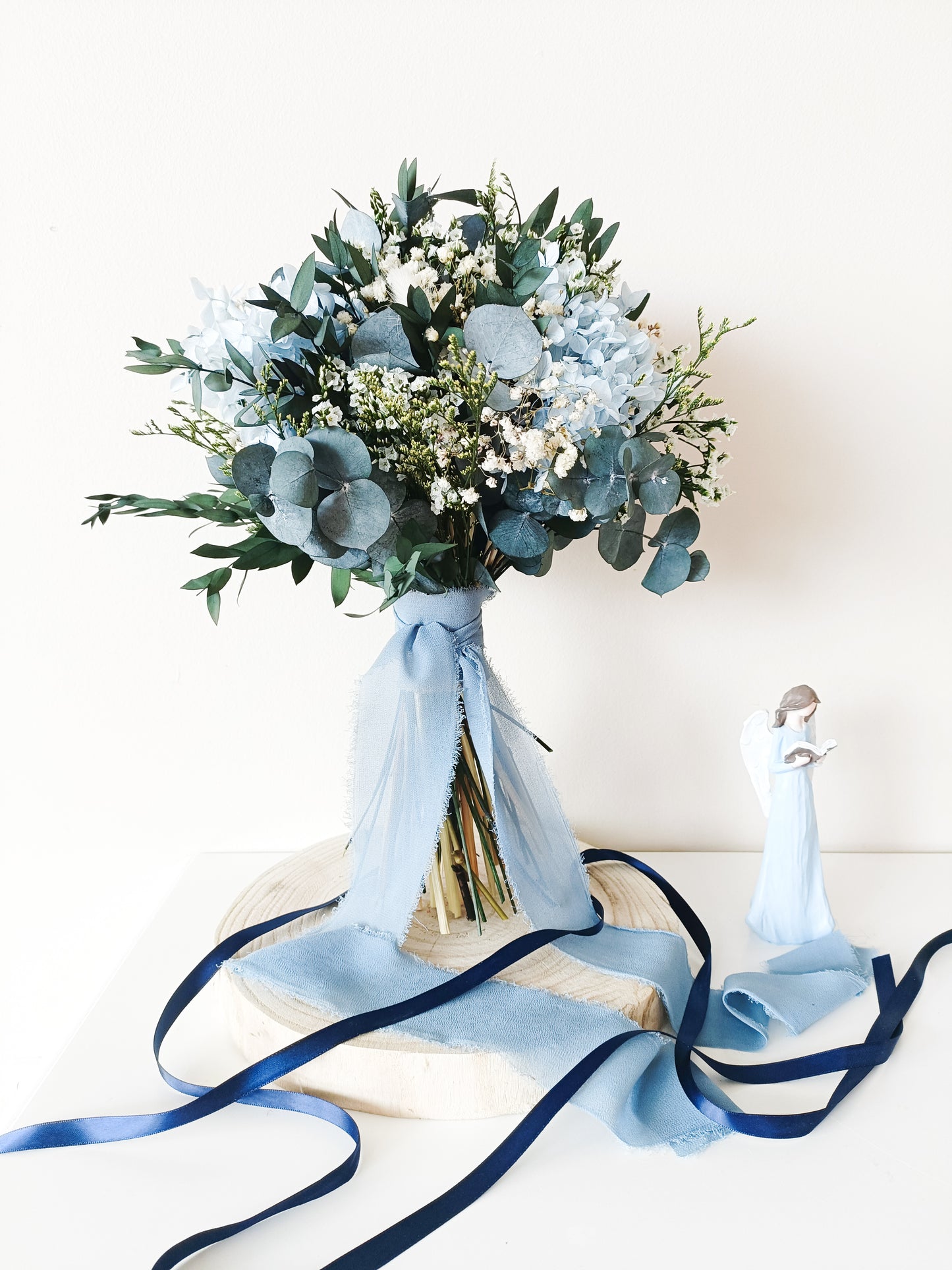 dusty blue wedding bouquet, blue and white bridal bouquet, soft blue floral arrangement, light blue preserved flowers, pastel blue bouquet, rustic blue wedding bouquet, boho blue bridal bouquet, elegant blue and white bouquet, romantic wedding bouquet, vintage-inspired bouquet, medium bridal bouquet, hand-tied wedding bouquet, loose organic bouquet, blue wedding theme, dusty blue wedding inspiration, rustic boho wedding flowers, elegant blue and white wedding, classic blue wedding bouquet