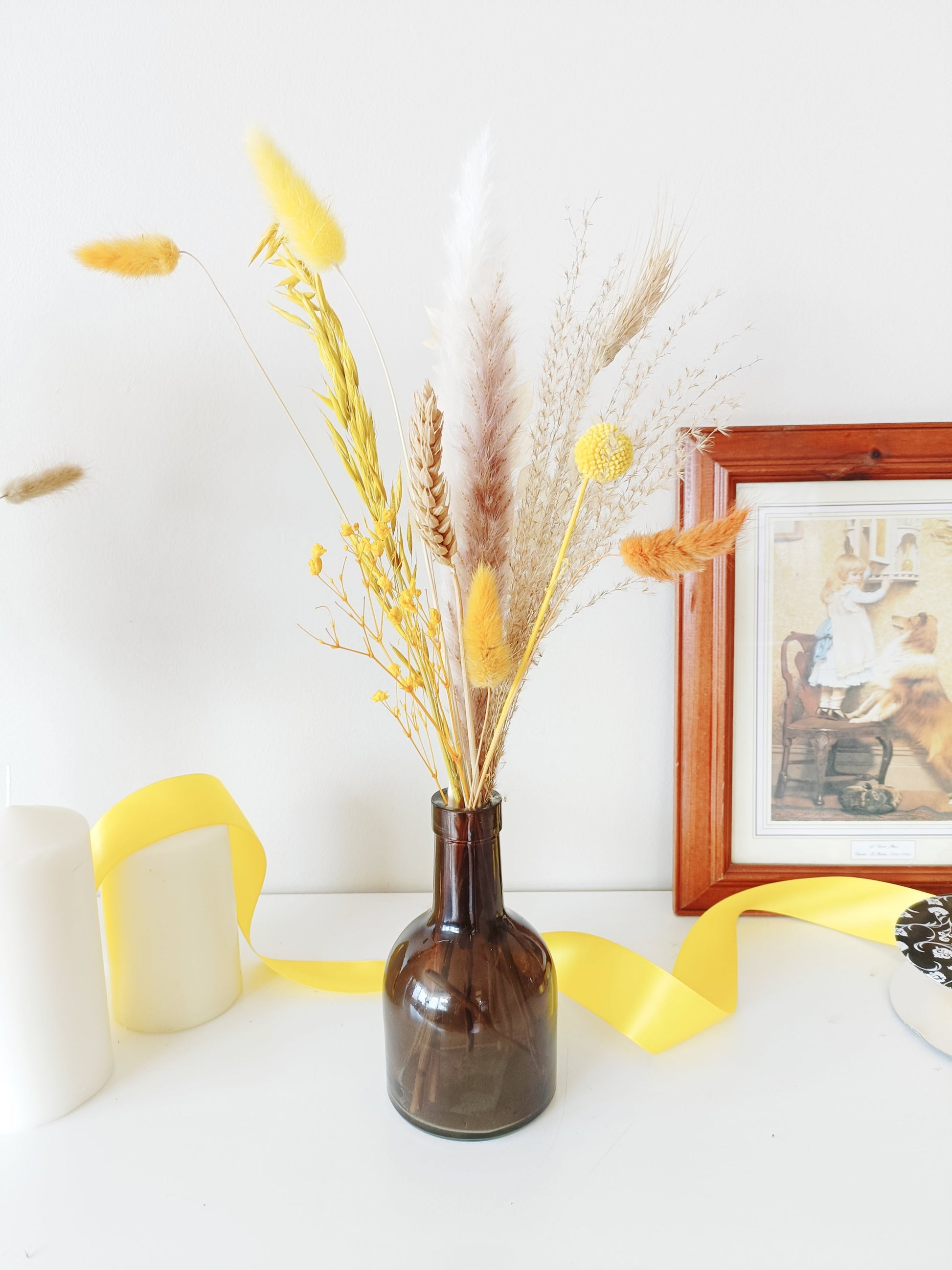 bold dried flower decor, vibrant floral centerpiece, blue and orange wedding flowers, artistic floral arrangement, striking dried flower setup, colorful wedding decor, preserved flower table display, unique rustic florals, dried flower boho centerpiece, modern botanical decor, vibrant boho styling, energetic floral arrangement, contrast floral table decor, wildflower-inspired setup, bright wedding flowers, dried pampas grass decor, eye-catching floral vase, handcrafted dried bouquet