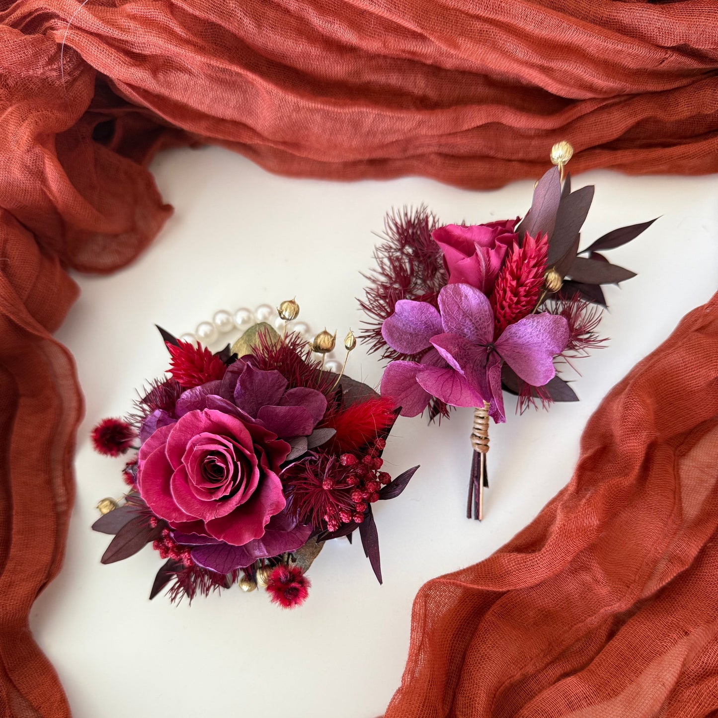 Burgundy corsage and boutonniere set with dried and artificial flowers, perfect for weddings and school formals