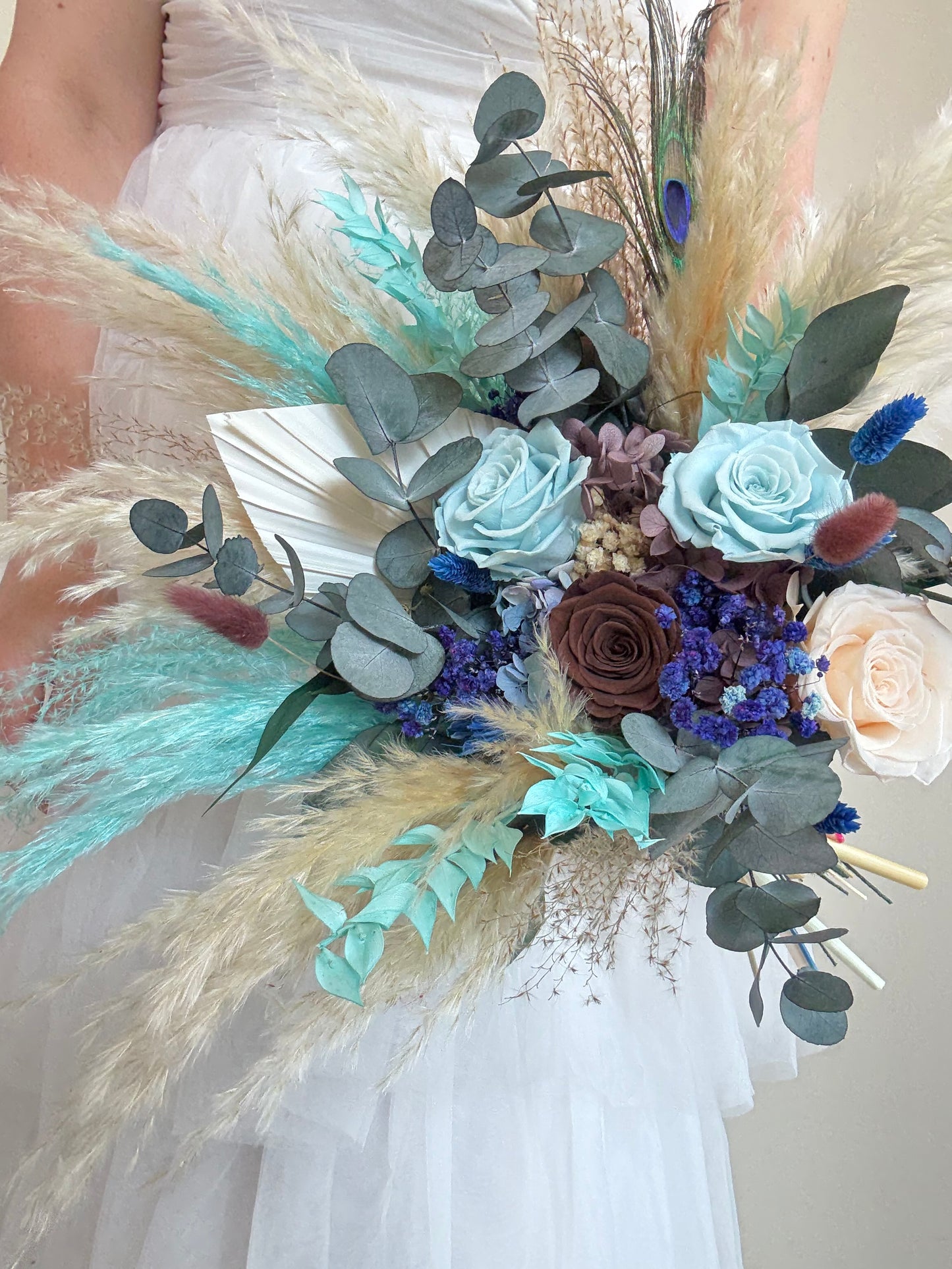 Natural dried bouquet in teal and blue tones, perfect for coastal and rustic weddings.