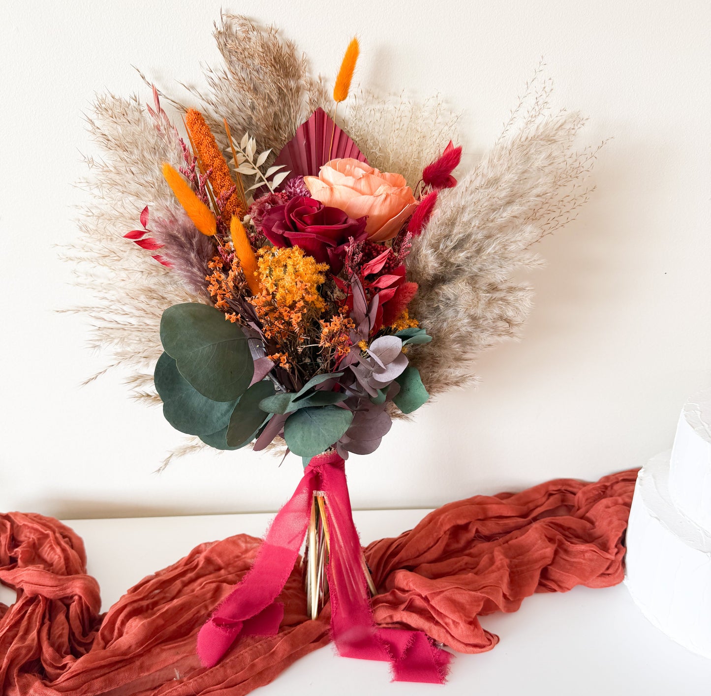 Colorful dried flower hair accessory styled as a crown, handmade with rustic autumn blooms — boho wedding headpiece for a natural look