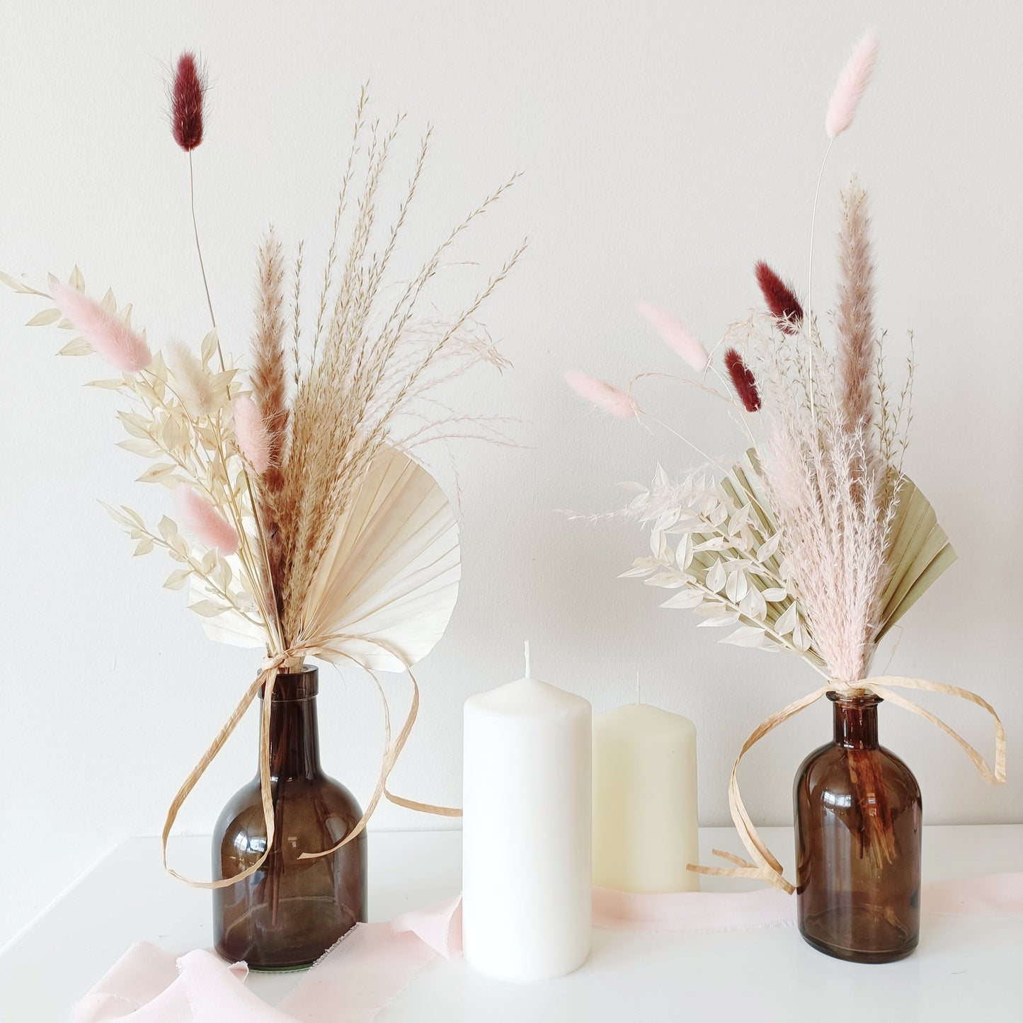 wedding table decor, event table styling, elegant centerpiece, floral arrangement, table setting, rustic wedding, boho table decor, vintage table setup, romantic tablescape, minimalist wedding decor, luxury event design, dried flower centerpiece, soft color palette, aesthetic table arrangement, candlelit dinner, natural wedding decor, modern table styling, cozy reception setup, timeless elegance, pastel wedding theme, chic tablescape, organic table decor, sophisticated floral design, intimate wedding setup