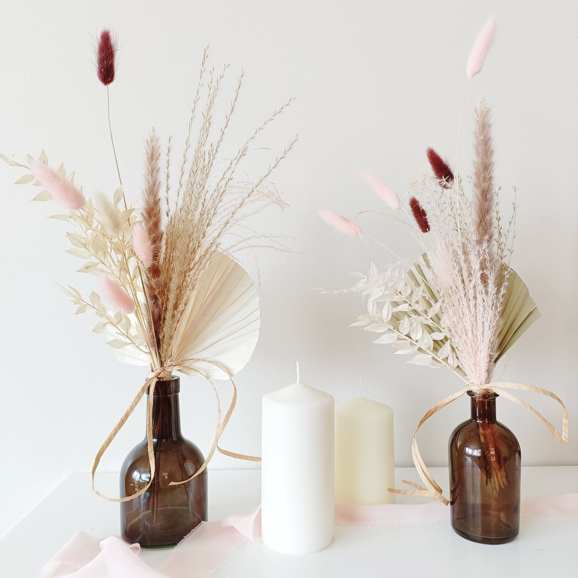 wedding table decor, event table styling, elegant centerpiece, floral arrangement, table setting, rustic wedding, boho table decor, vintage table setup, romantic tablescape, minimalist wedding decor, luxury event design, dried flower centerpiece, soft color palette, aesthetic table arrangement, candlelit dinner, natural wedding decor, modern table styling, cozy reception setup, timeless elegance, pastel wedding theme, chic tablescape, organic table decor, sophisticated floral design, intimate wedding setup