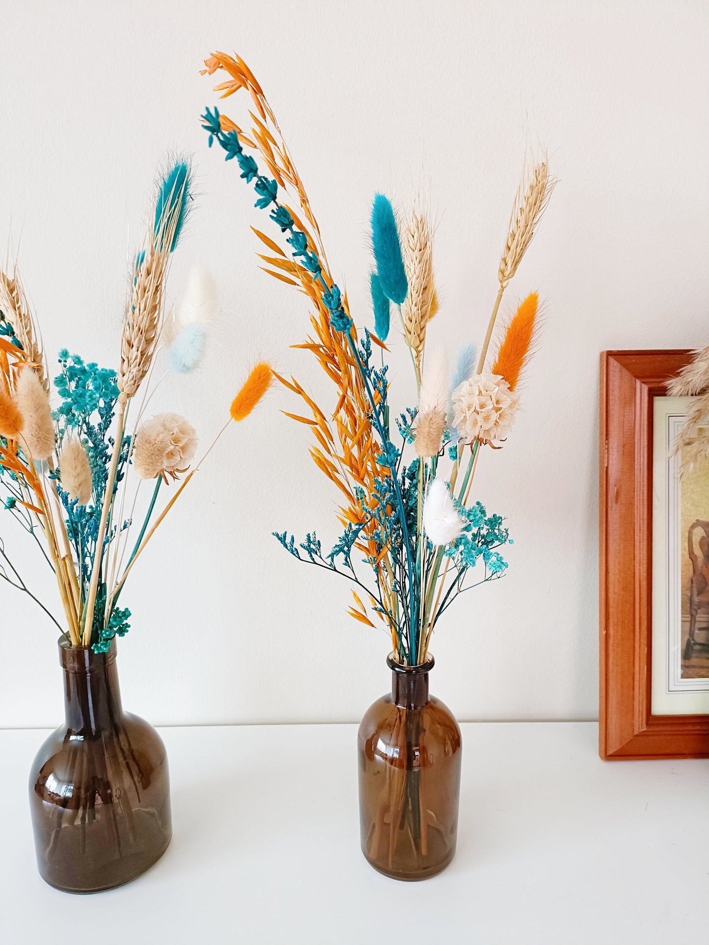 Boho centerpiece, dried flower decor, wedding table flowers, rustic floral arrangement, bohemian flower vase, minimalist floral styling, pampas grass arrangement, dried floral bouquet, neutral home decor, aesthetic flower setup, vintage flower display, farmhouse flower decor, pastel dried flowers, blush wedding centerpiece, romantic floral arrangement, natural dried bouquet, table wedding flowers, soft floral centerpiece, eco-friendly wedding flowers, preserved flower display, rustic wedding decor