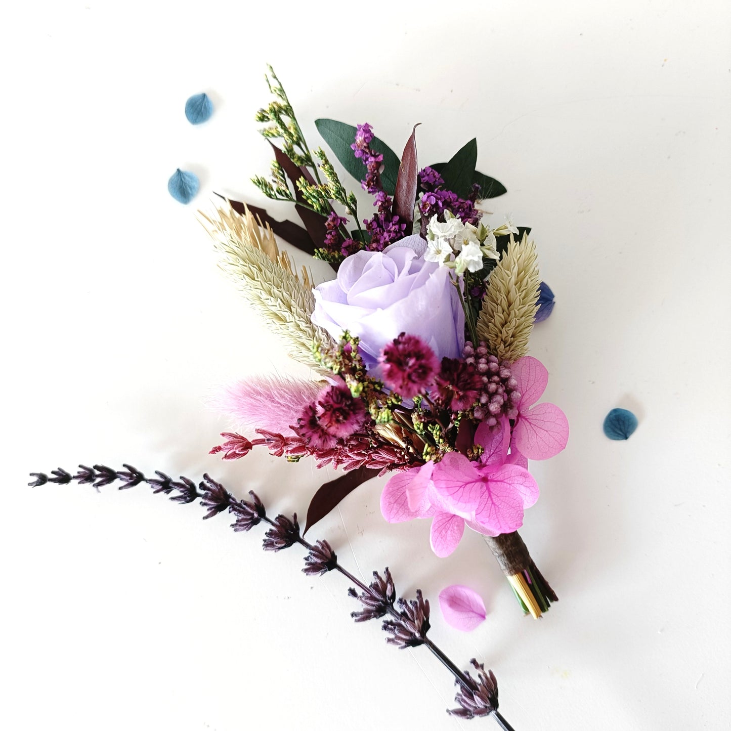Romantic groom boutonniere with light purple rose, dried grasses and dusty pink accents