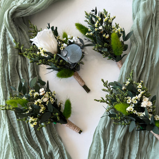 Four floral bouquets with greenery and white flowers arranged in a circular pattern on a light background.