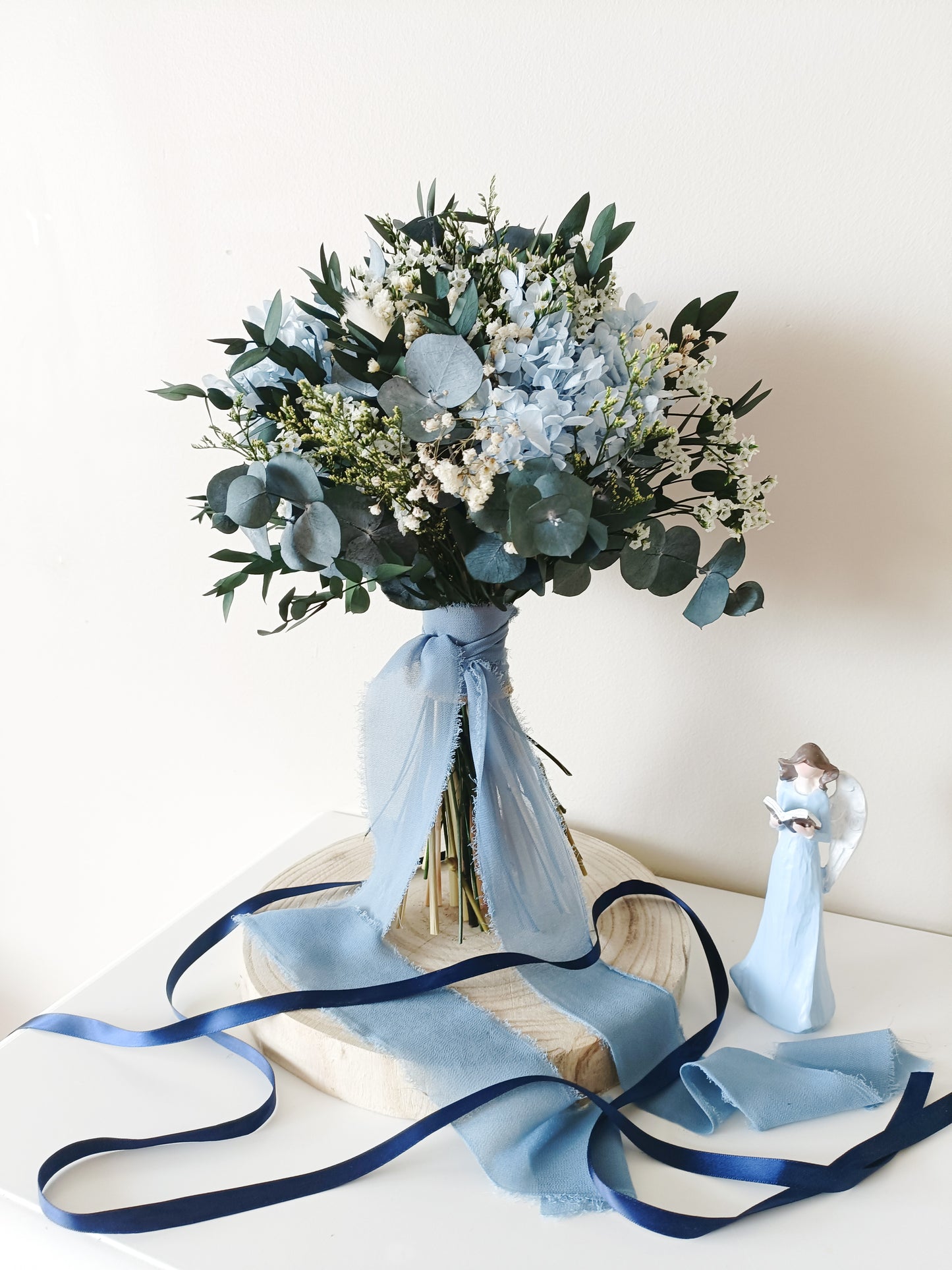 dusty blue wedding bouquet, blue and white bridal bouquet, soft blue floral arrangement, light blue preserved flowers, pastel blue bouquet, rustic blue wedding bouquet, boho blue bridal bouquet, elegant blue and white bouquet, romantic wedding bouquet, vintage-inspired bouquet, medium bridal bouquet, hand-tied wedding bouquet, loose organic bouquet, blue wedding theme, dusty blue wedding inspiration, rustic boho wedding flowers, elegant blue and white wedding, classic blue wedding bouquet
