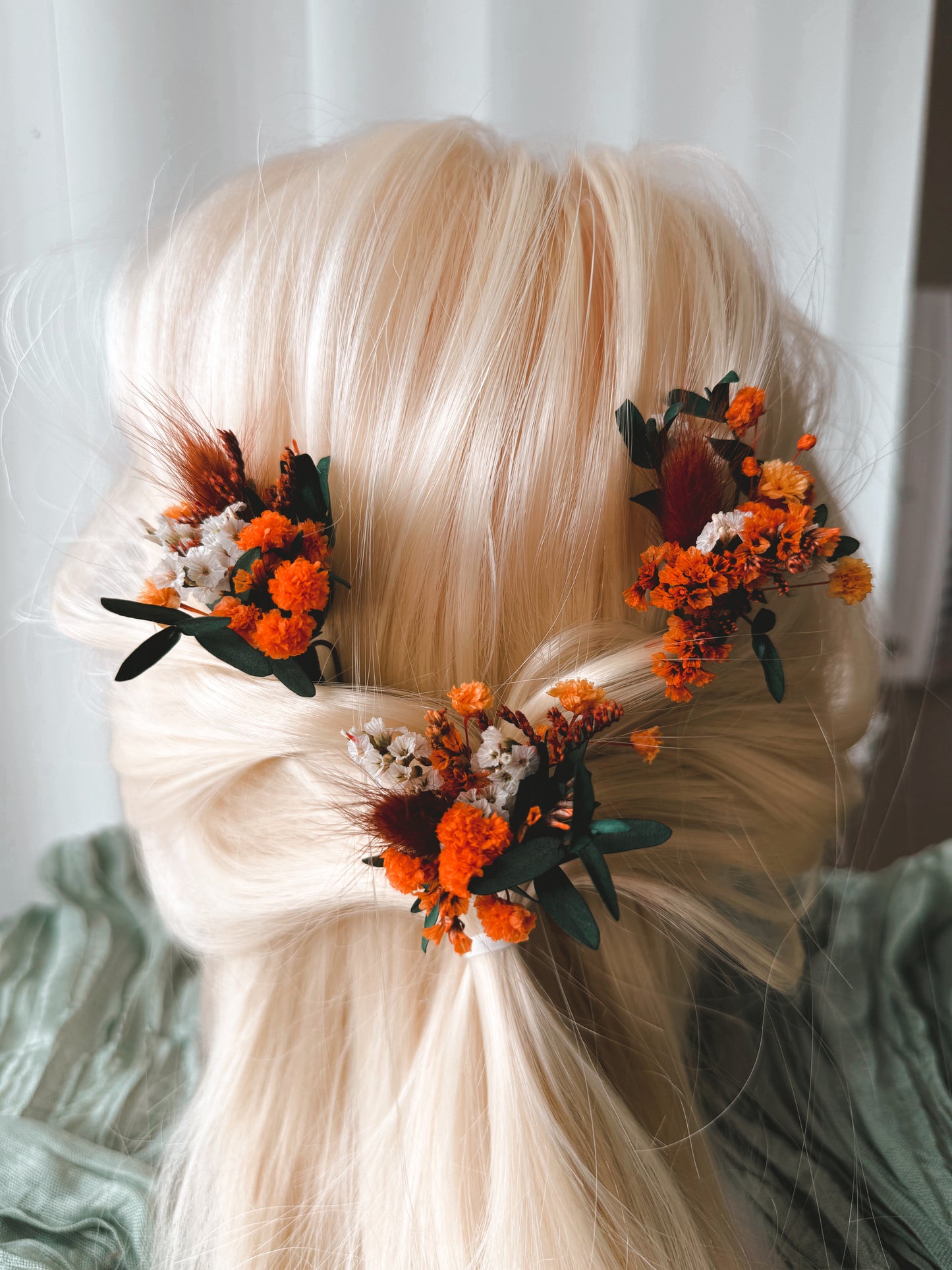 Dried flower bridal hair accessories in orange and greenery for boho wedding hairstyle
