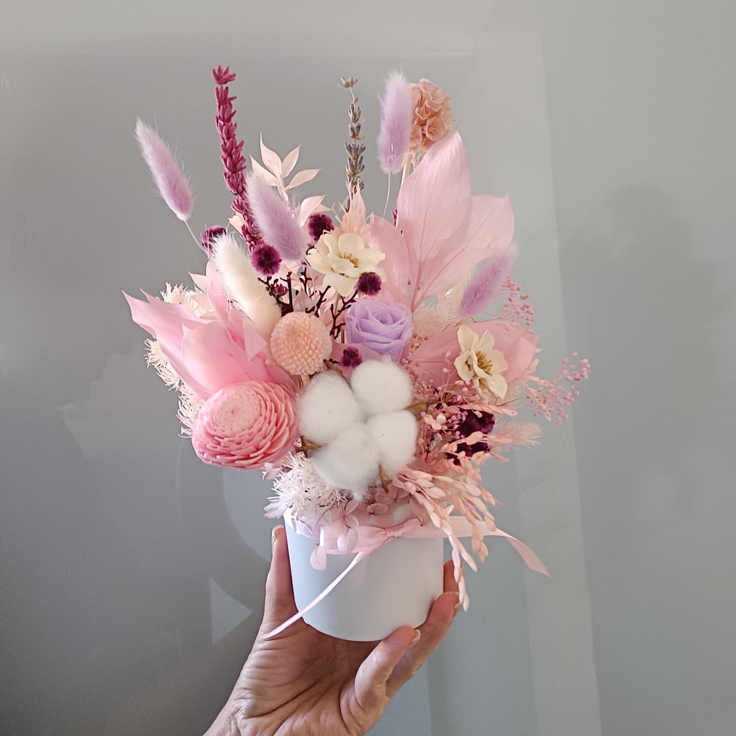 Whimsical pastel dried flower bouquet with soft textures and romantic tones, perfect for gifting to a friend or brightening up a cozy room.