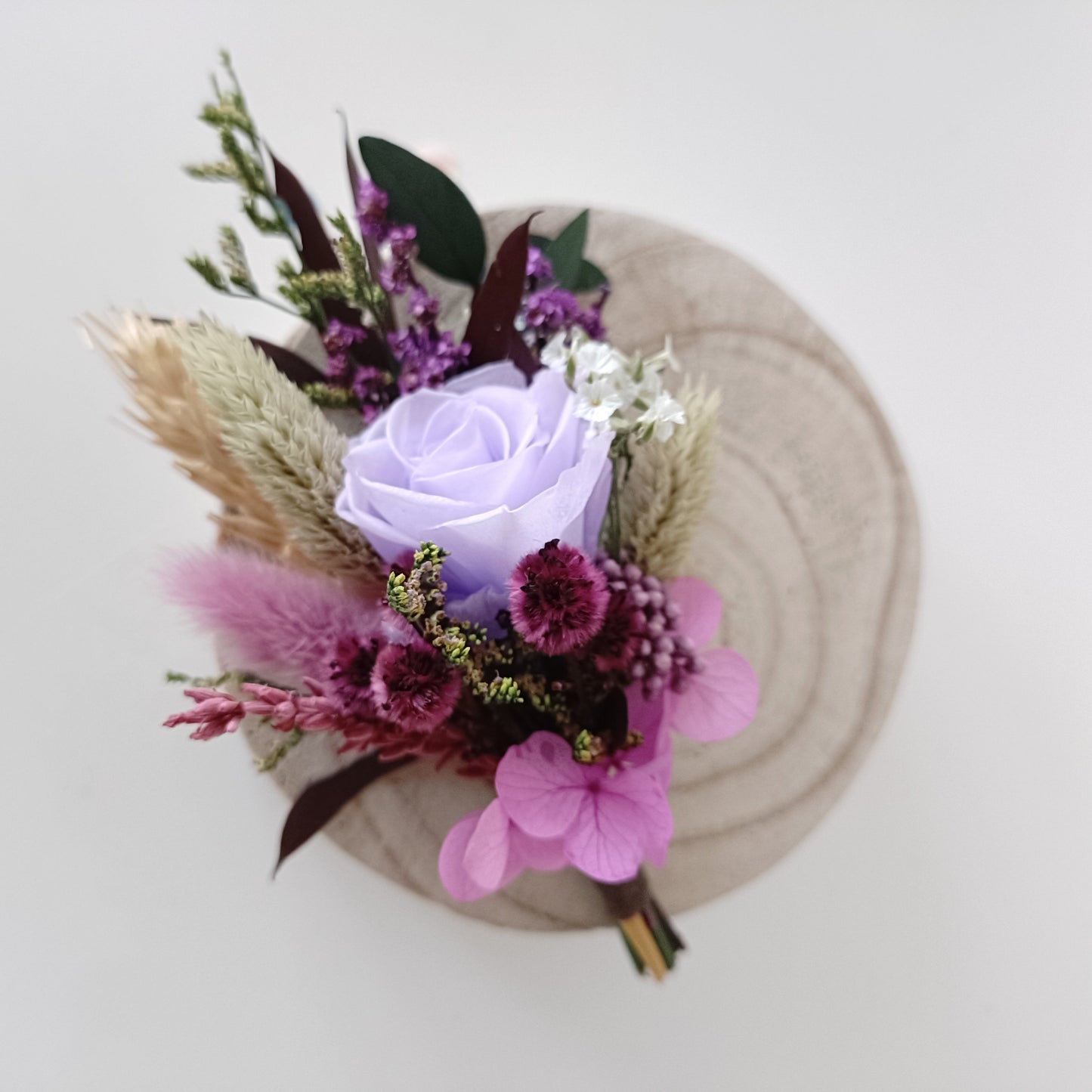 Lavender rose dried boutonniere with purple and plum preserved flowers for boho wedding