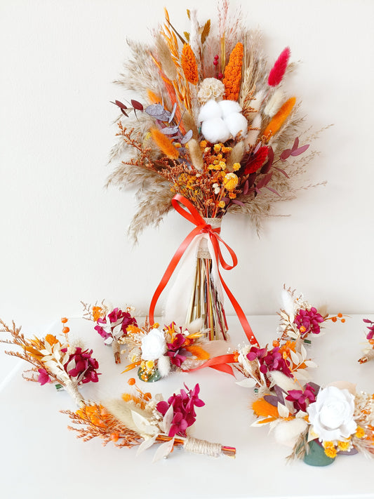 Autumn-inspired dried flower bridal bouquet with cotton, burgundy, and orange accents, shown with matching accessories.