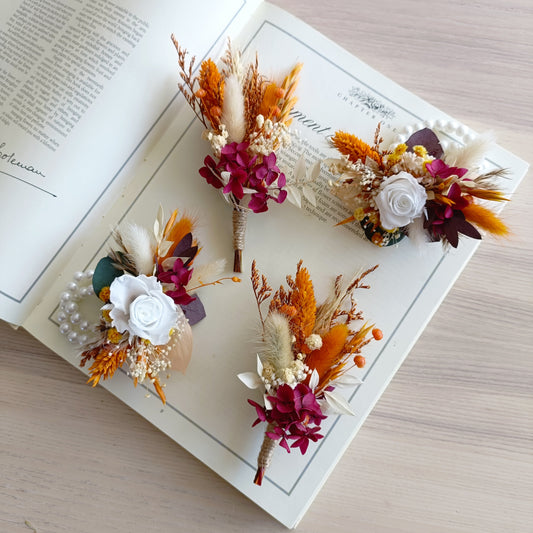 Rustic bridal wrist corsage with white sola flower and burnt orange dried florals
