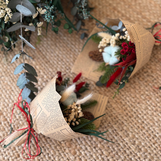Small dried flower Christmas bouquet with cotton bloom, cone, and preserved greenery — eco friendly festive gift.