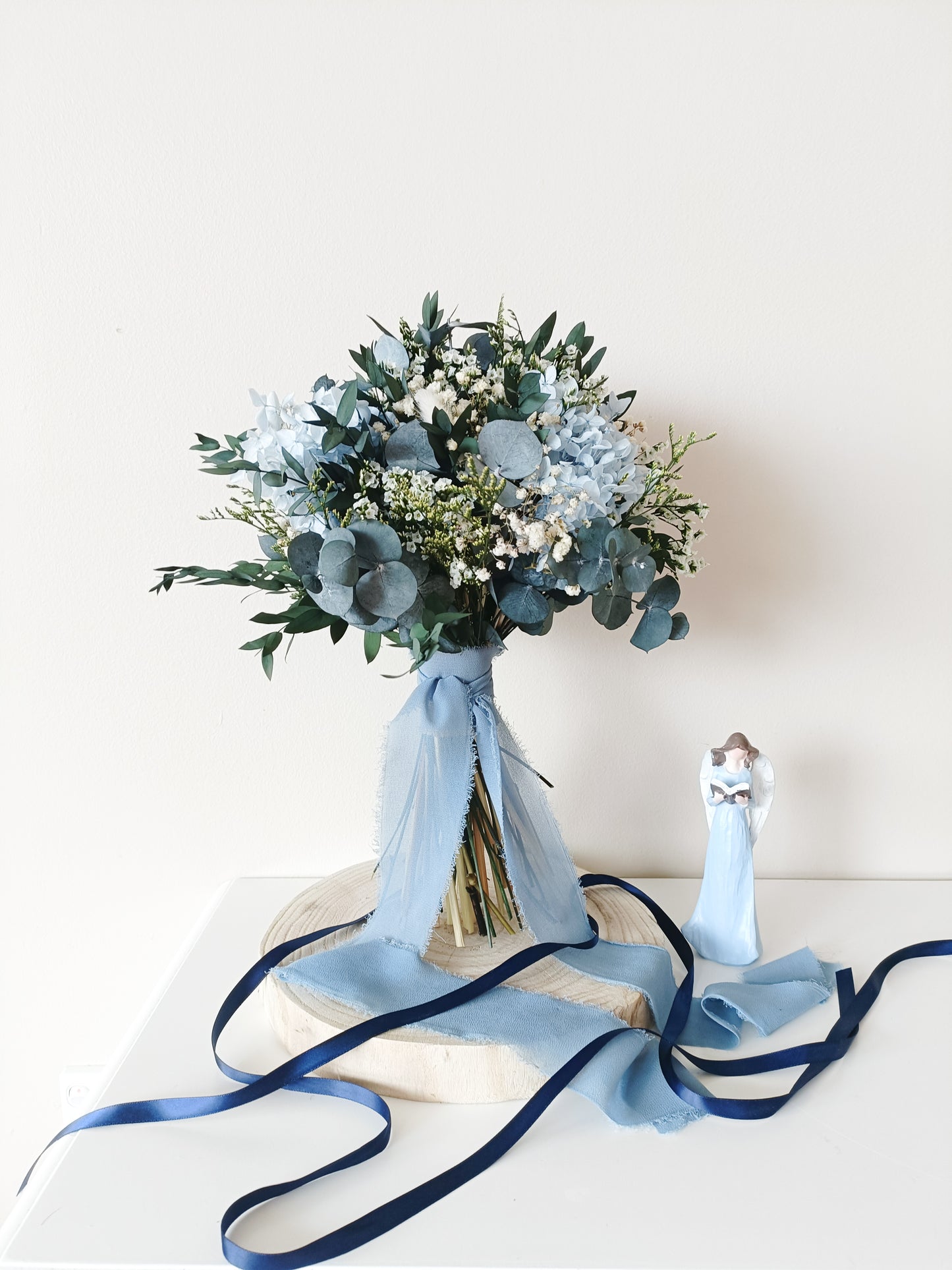 dusty blue wedding bouquet, blue and white bridal bouquet, soft blue floral arrangement, light blue preserved flowers, pastel blue bouquet, rustic blue wedding bouquet, boho blue bridal bouquet, elegant blue and white bouquet, romantic wedding bouquet, vintage-inspired bouquet, medium bridal bouquet, hand-tied wedding bouquet, loose organic bouquet, blue wedding theme, dusty blue wedding inspiration, rustic boho wedding flowers, elegant blue and white wedding, classic blue wedding bouquet