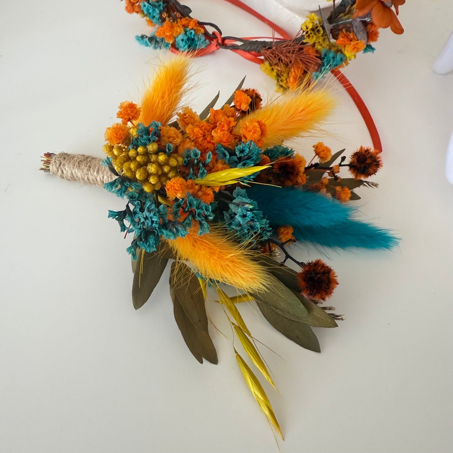 Sunflower boutonniere with teal, mustard and burnt orange dried flowers