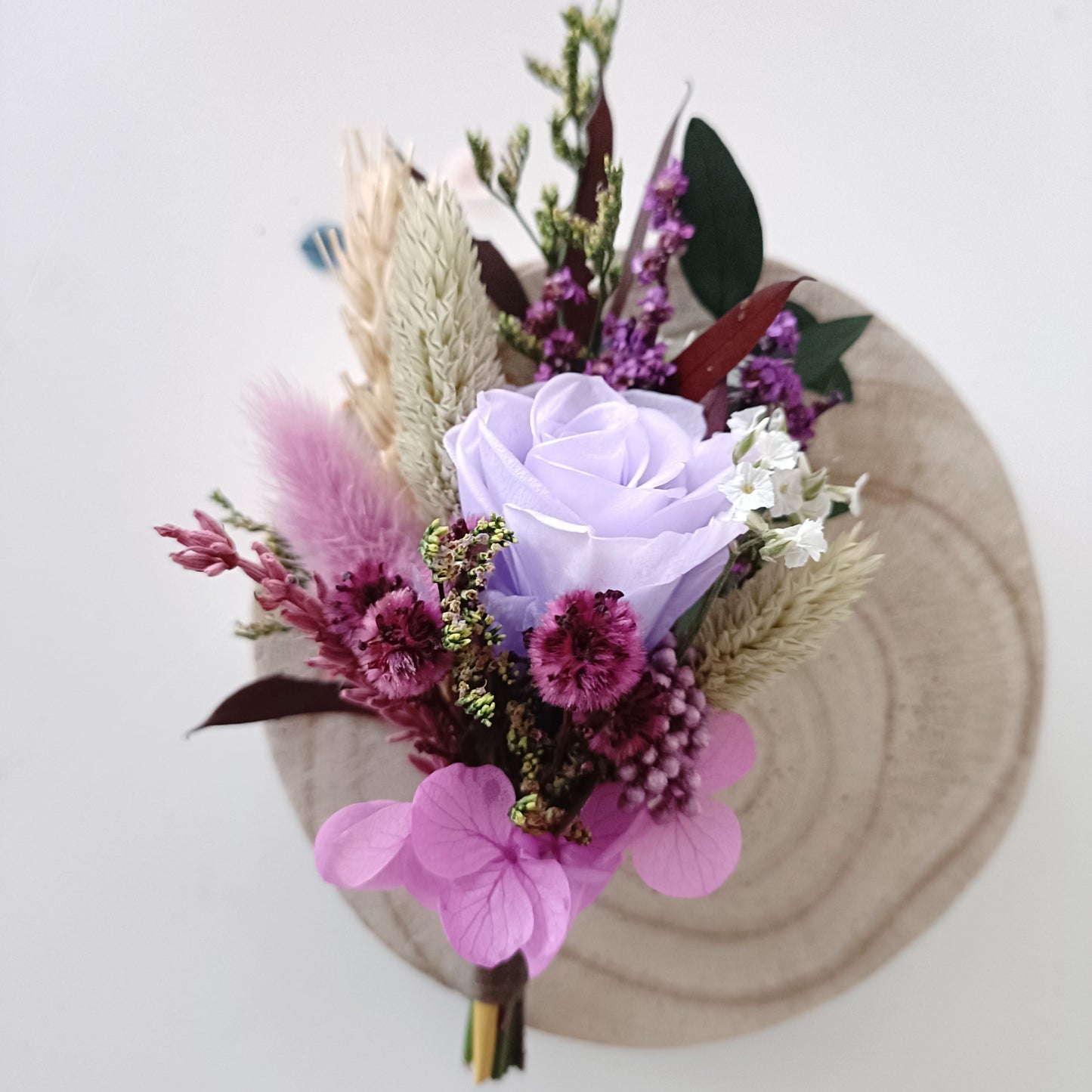 Handmade wedding buttonhole in lavender, burgundy and blush tones with preserved florals