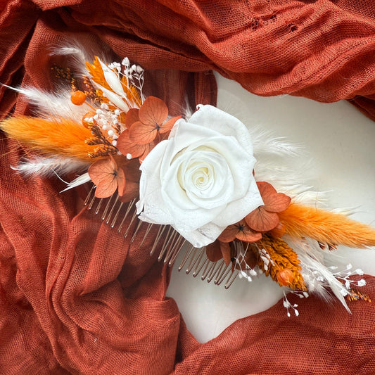 White rose bridal hair comb with burnt orange preserved hydrangea and dried flowers for a romantic wedding hairstyle