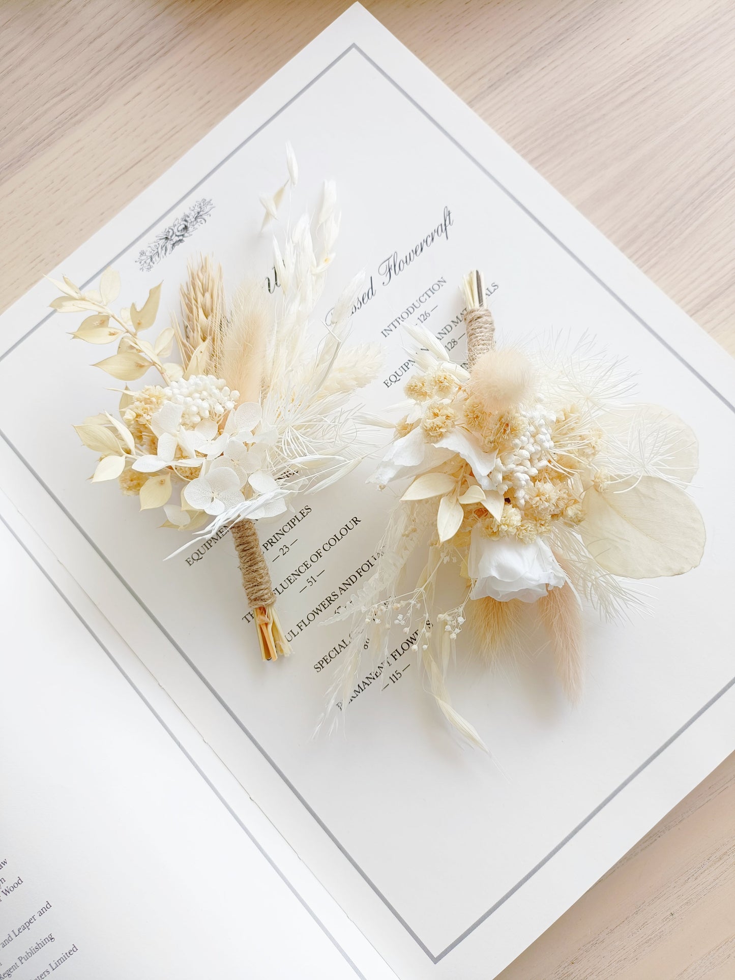 Elegant dried flower boutonniere featuring a white sola rose, preserved grasses, bunny tails, ivory blooms, and soft beige tones. Ideal for groom, groomsmen, or formal events in rustic or boho style.