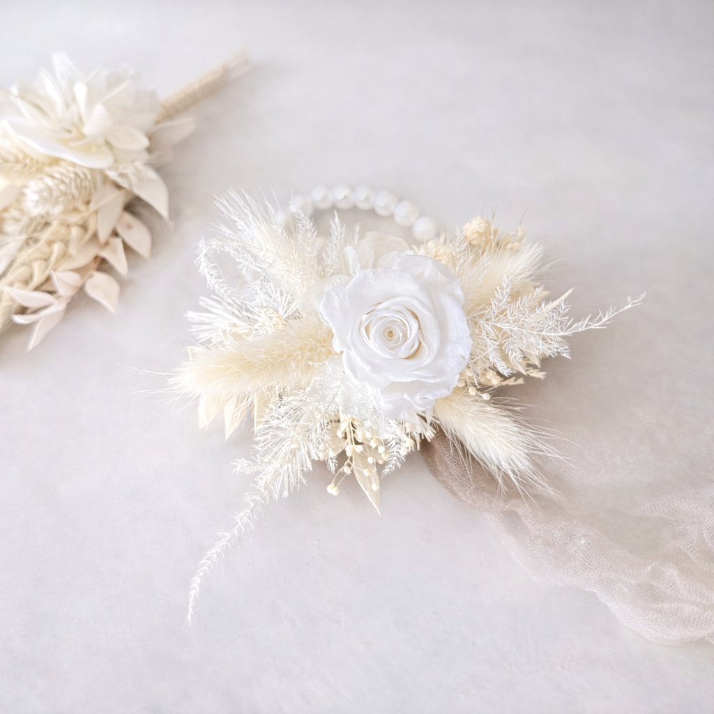 Wedding wrist corsage in ivory tones