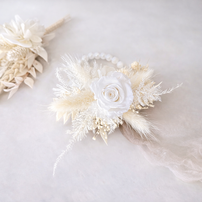 Wedding wrist corsage in ivory tones