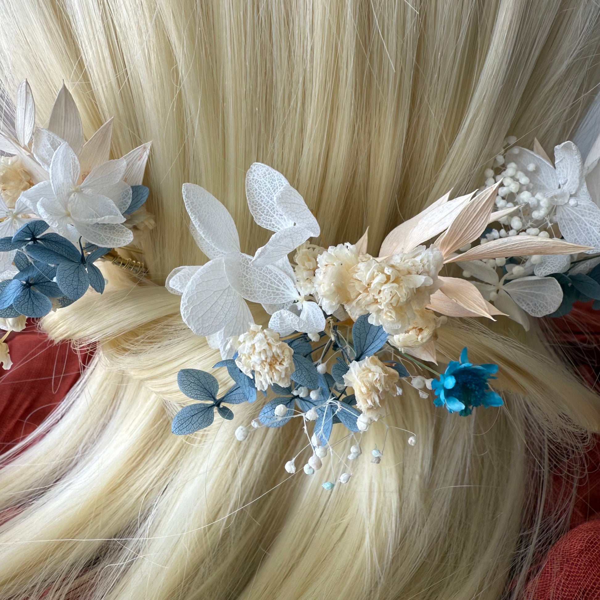 	Elegant blue flower hair pins for wedding updo or bridesmaid look