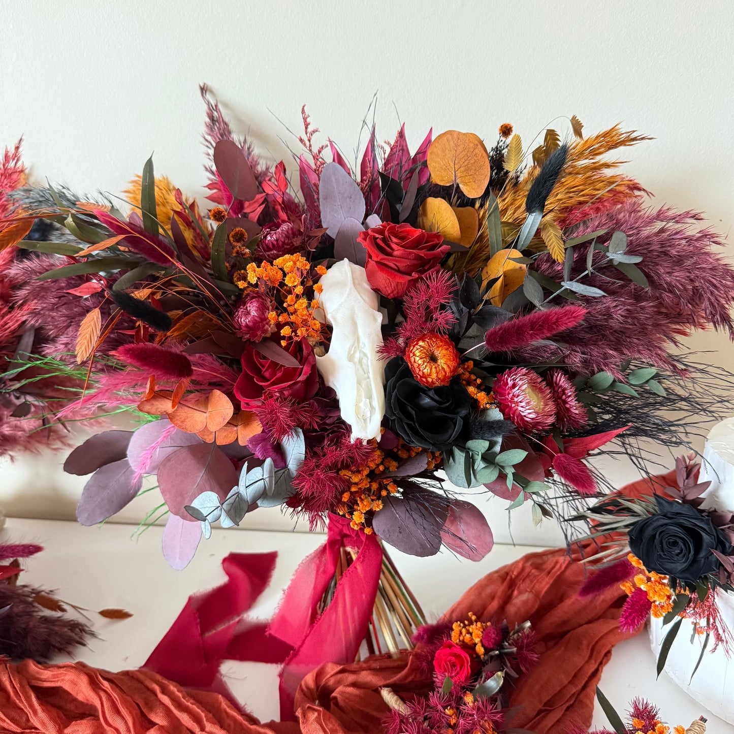 Burgundy bridal bouquet with white skull
