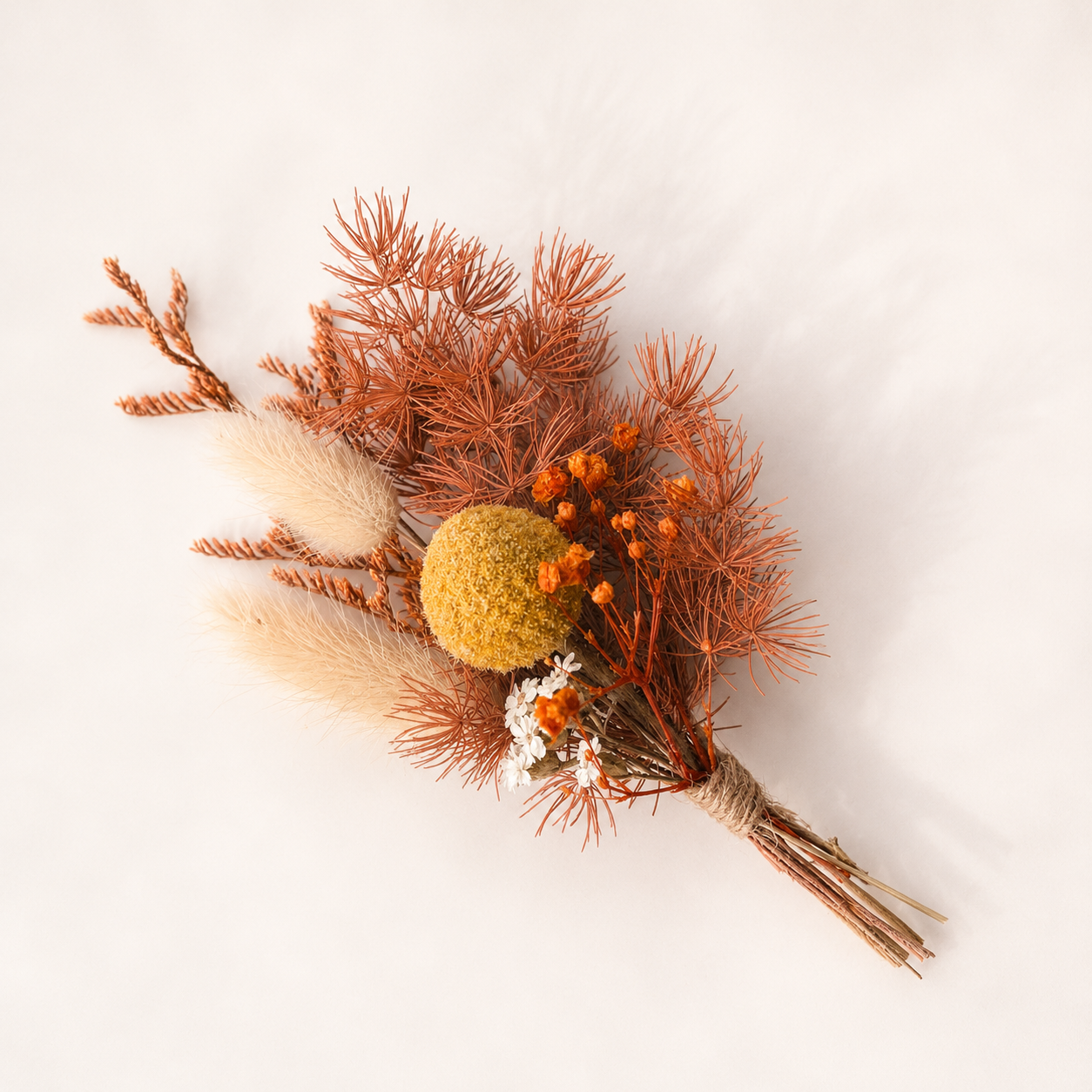 Mini dried flower bouquet inspired by Australian native colours with preserved botanicals and rustic wedding style.