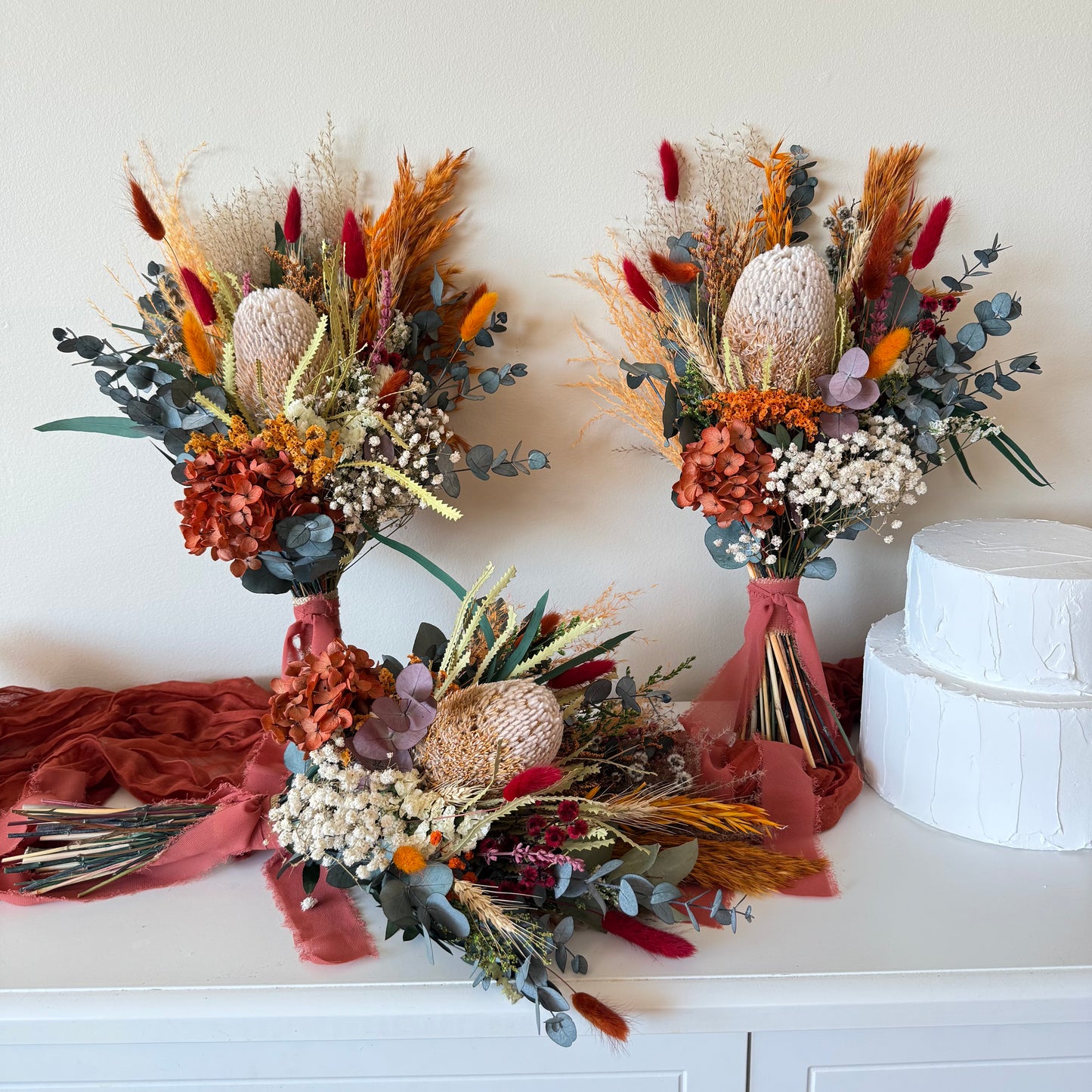 Australian Native Wedding Flower Collection featuring bridal bouquet, bridesmaid bouquets and cake flowers