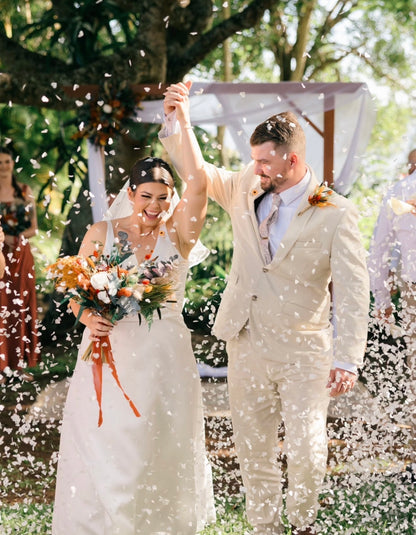 Terracotta and burnt orange wedding flower collection with dried bridal bouquets, bridesmaid bouquets and ceremony flowers in warm earthy autumn tones