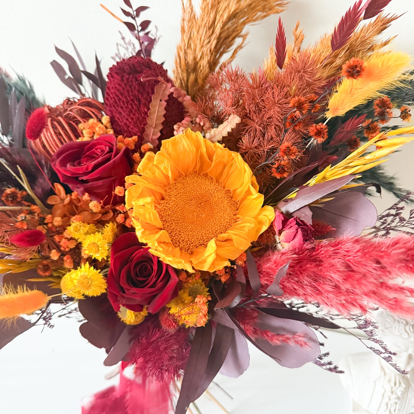 Handmade burgundy dried bridal bouquet created in Australia for boho weddings