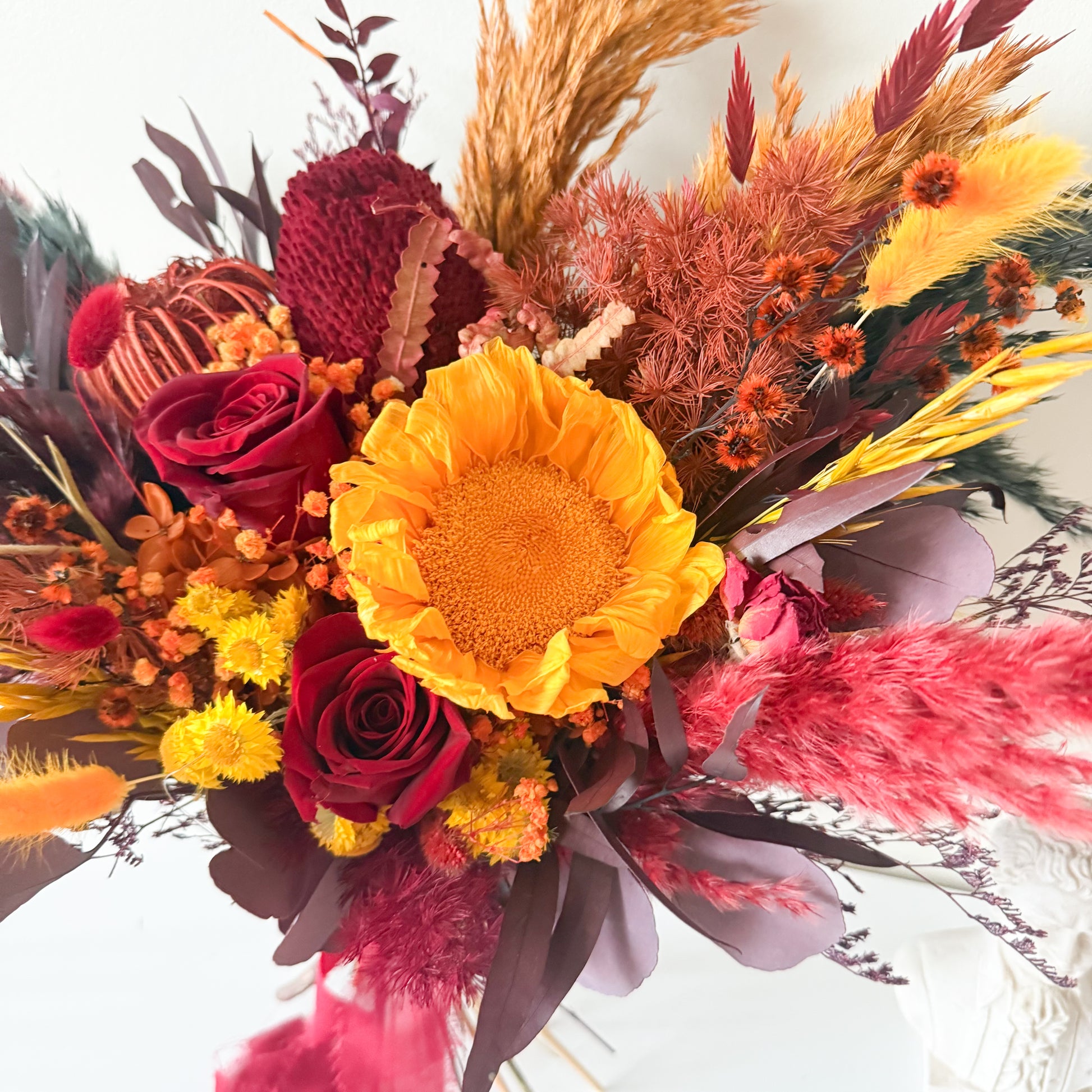 Handmade burgundy dried bridal bouquet created in Australia for boho weddings