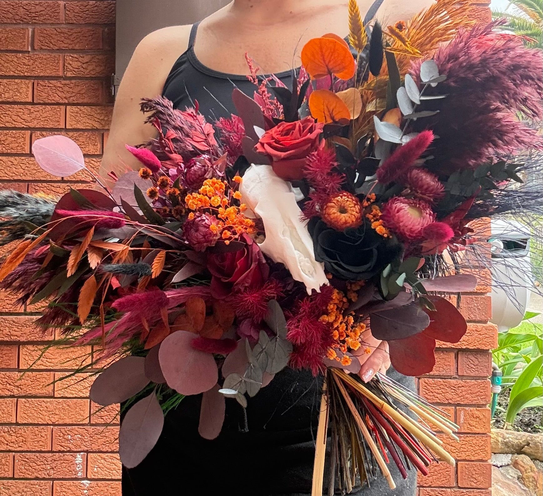 Bride with moody wedding bouquet 