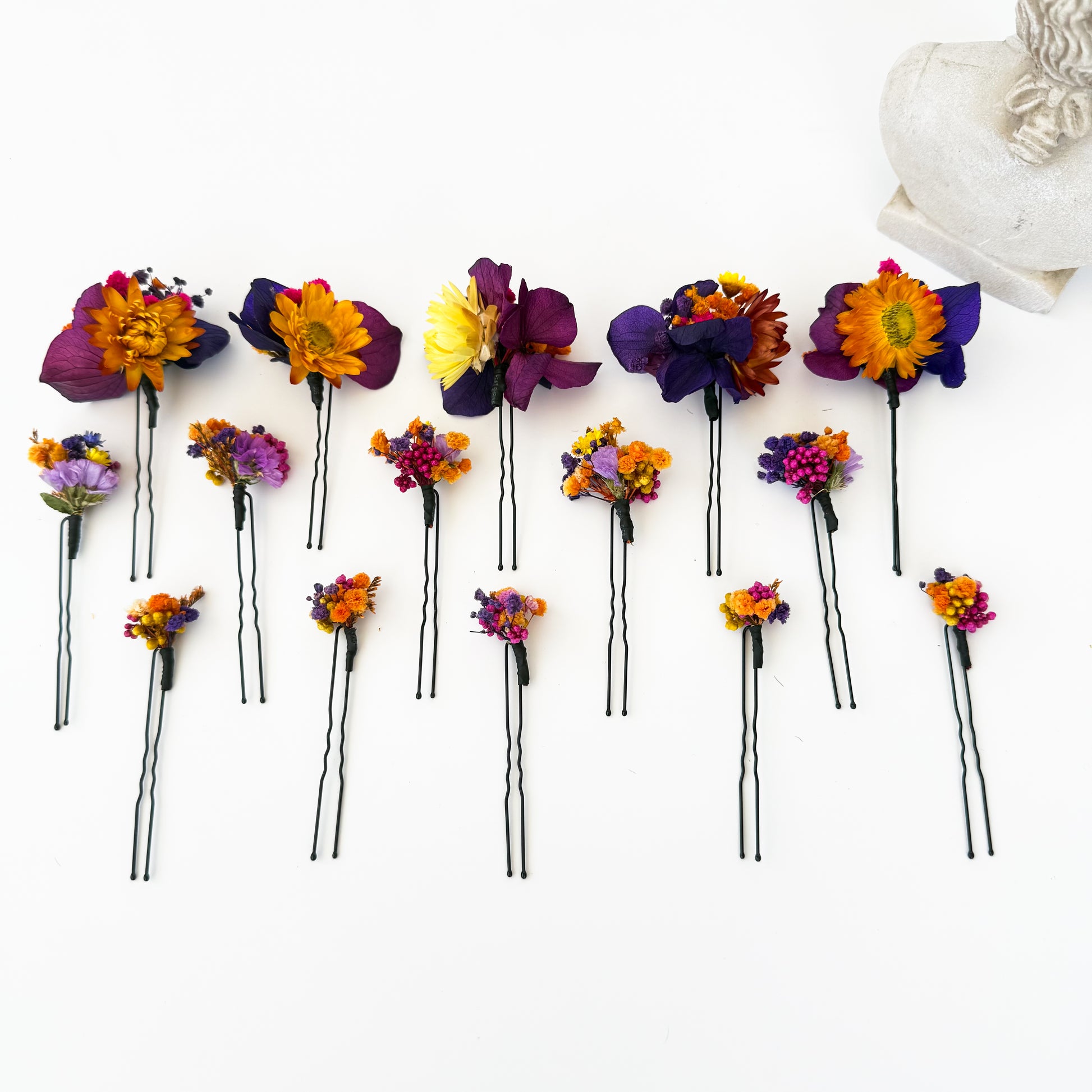 Dried flower hair pins displayed with braided hairstyle, handmade boho bridal accessories