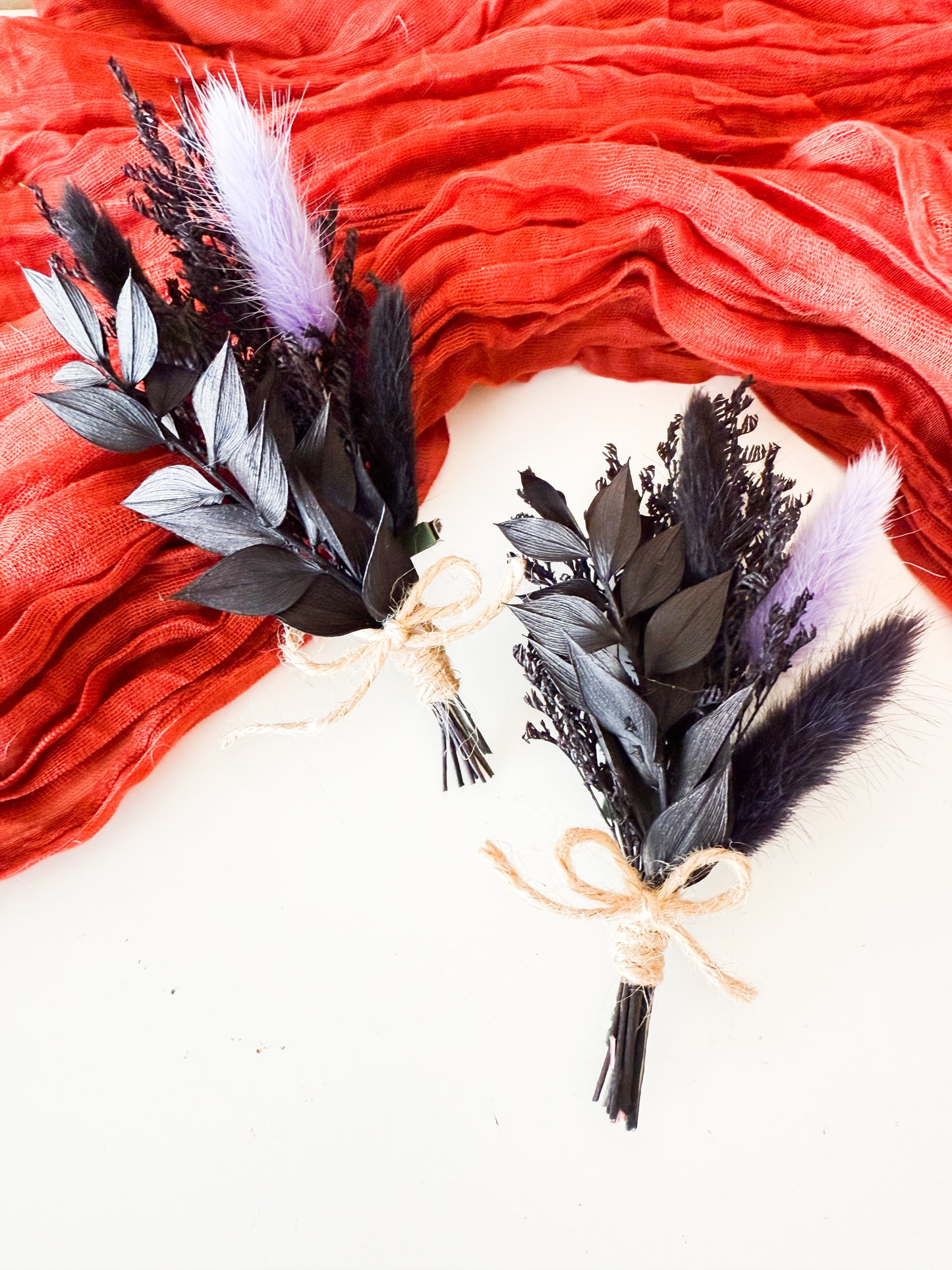 Elegant dried flower boutonniere in black and lilac with bunny tails and rustic twine, perfect for groom or groomsmen accessories