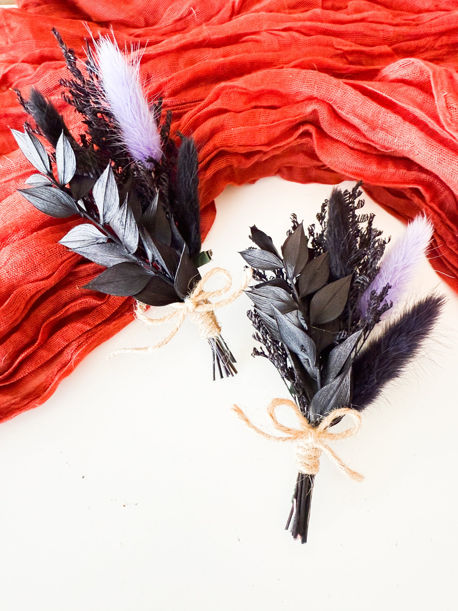 Elegant dried flower boutonniere in black and lilac with bunny tails and rustic twine, perfect for groom or groomsmen accessories