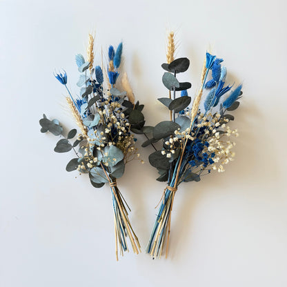 Blue and ivory preserved bud vase flower featuring eucalyptus, wheat and dried wildflowers.