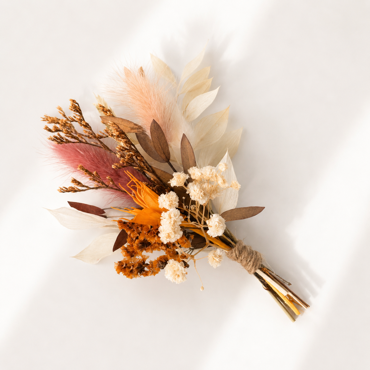 Soft blush and neutral mini dried flower bouquet with preserved florals for bridal party gifts and wedding favours.